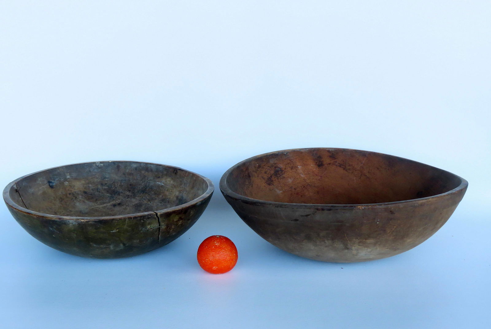 Two primitive treenware mixing bowls. The largest with molded edge in very good condition with (1 of 13)