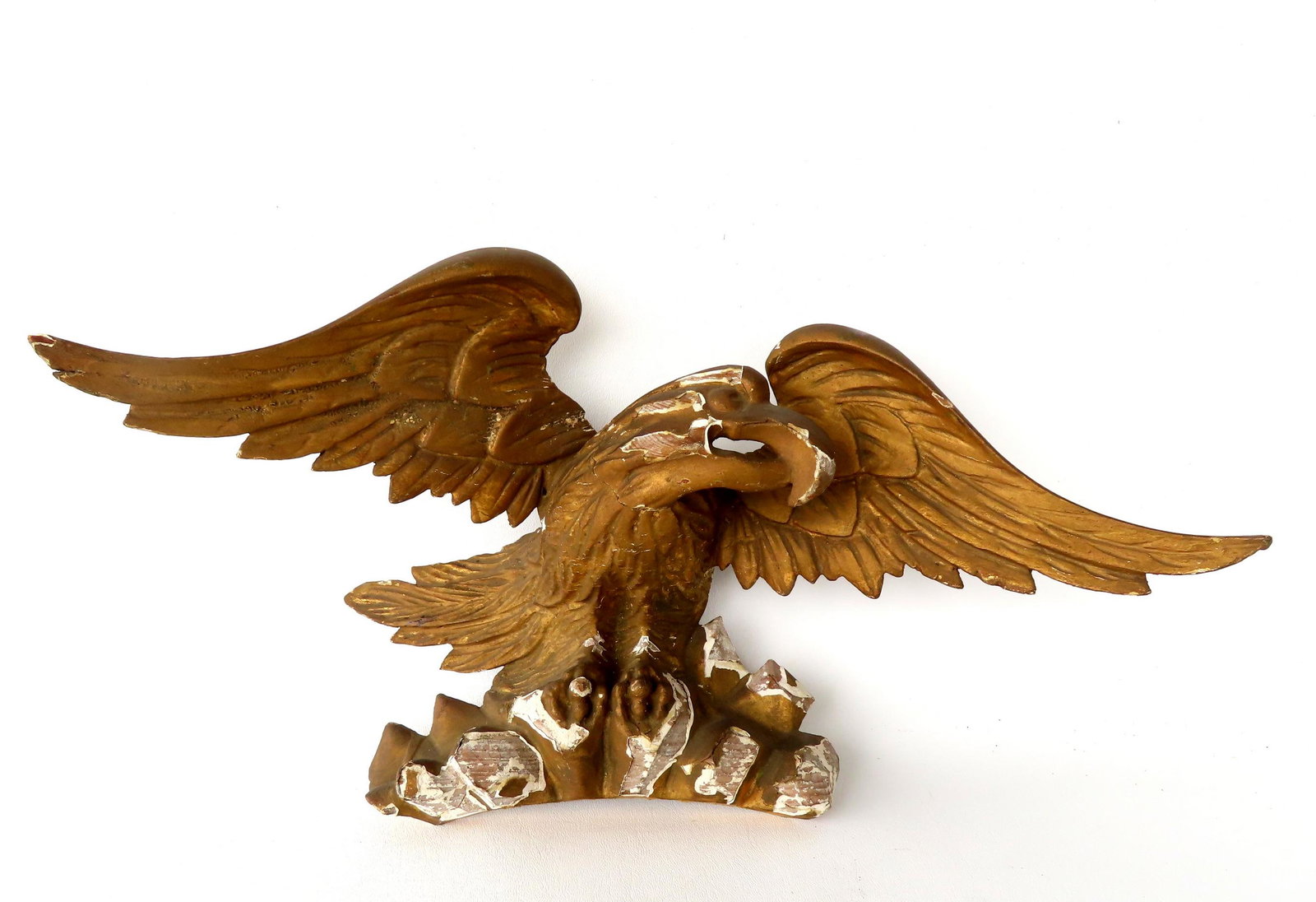 A carved wooden gilt gesso  spread wing eagle finial, probably off an early 19th century mirror. (1 of 3)