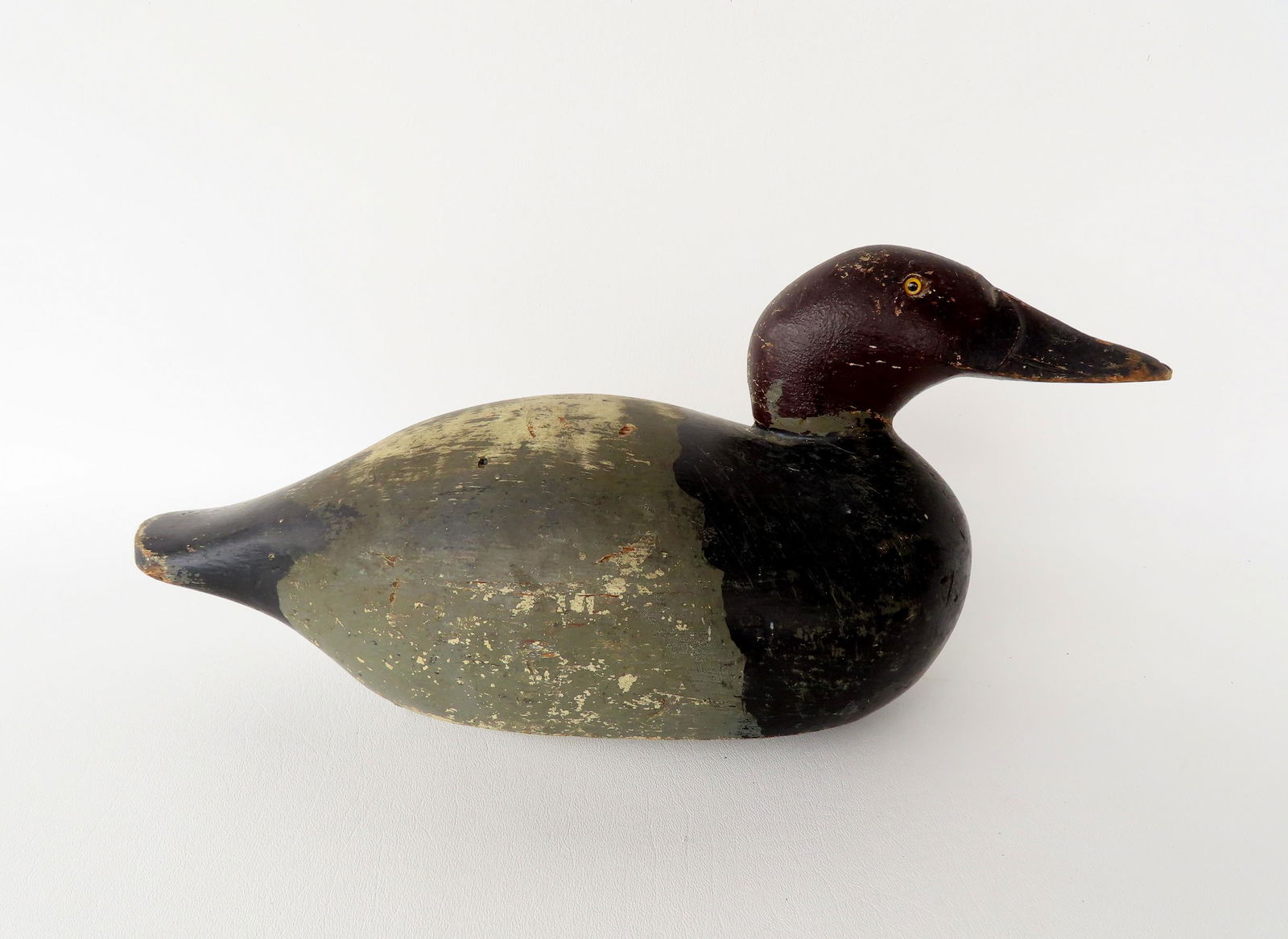 A good Canvasback duck decoy in original paint with glass eyes, detailed carved beak, original (1 of 5)