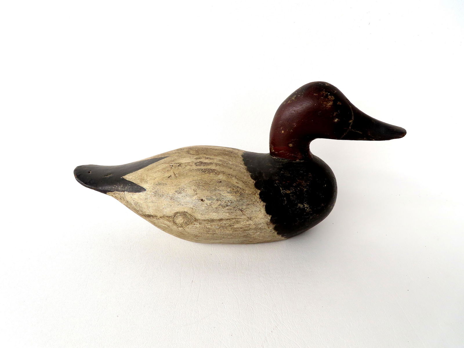 A Seneca Lake NY Canvasback duck decoy in original paint with carved beak, signed in pencil on base (1 of 5)