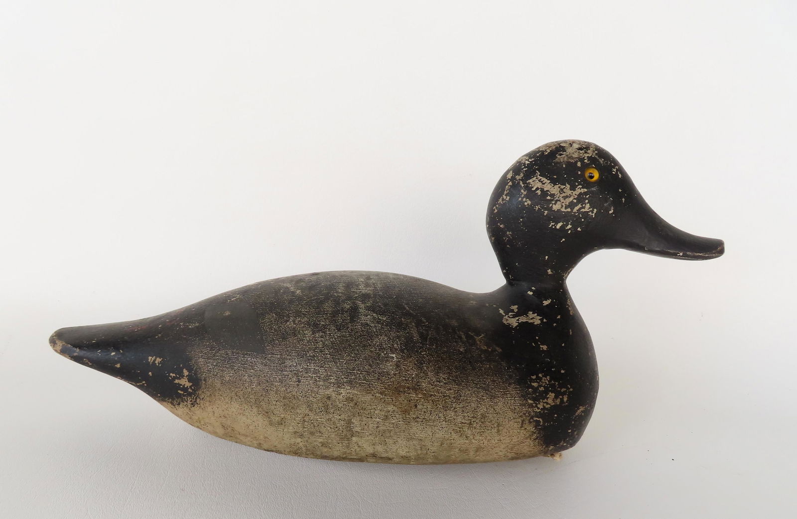 A blue bill decoy with glass eyes, probably Mason, early 20th century - some paint wear, but overall (1 of 5)