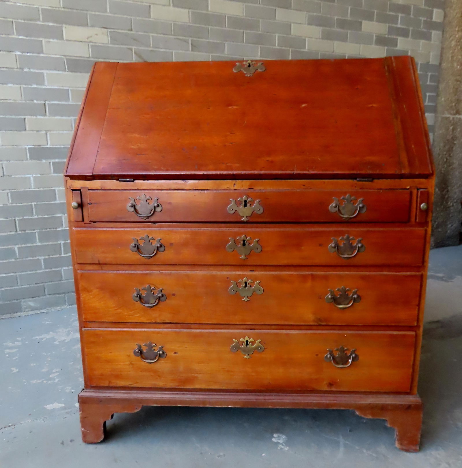 An American Chippendale cherry slant front desk with fitted interior, having 4 graduated drawers (1 of 12)