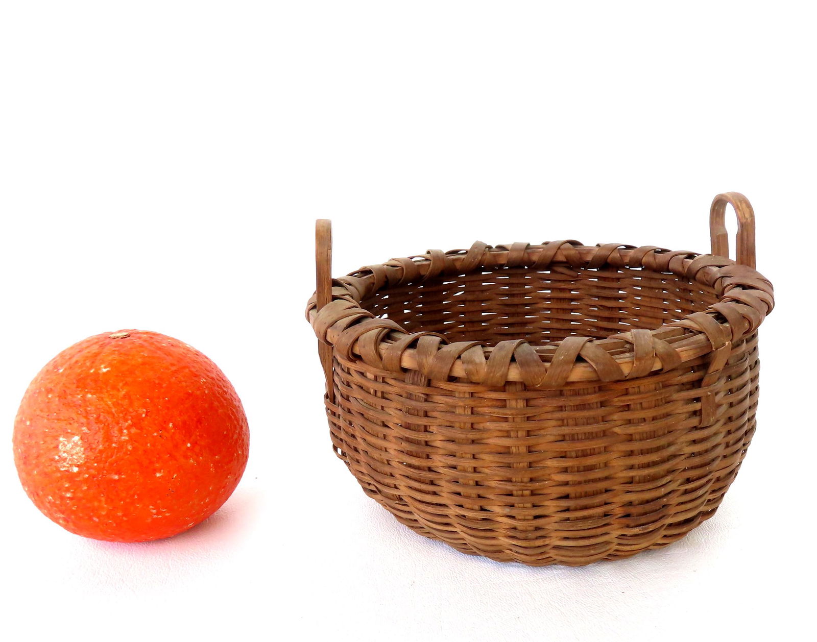 A small Taghkanic basket with 2 loop handles. Typical pushed up bottom and crisscrossed rim, 19th (1 of 8)