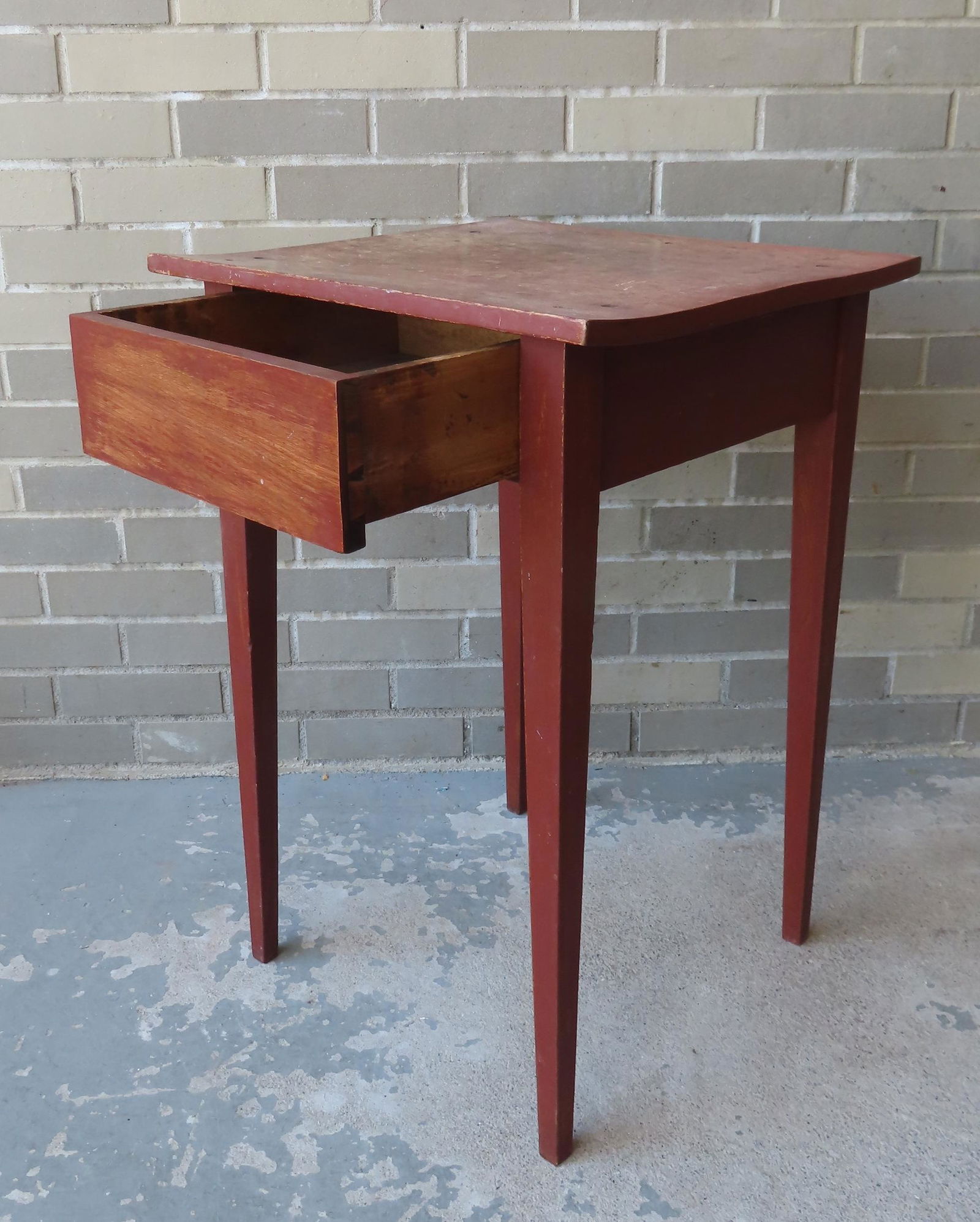 A Hepplewhite one drawer stand in original red paint. The drawer is without a pull and was made that (1 of 9)