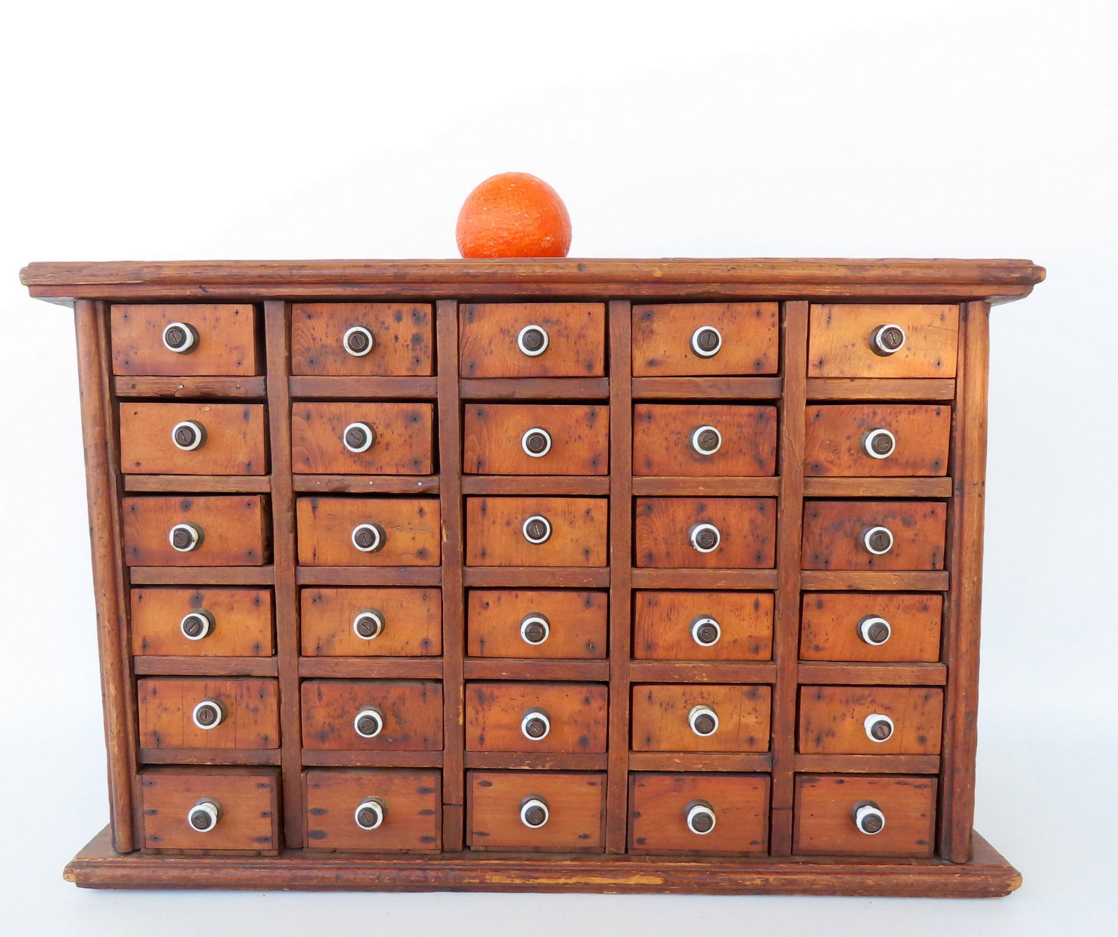 A 30 drawer utility cabinet with porcelain pulls, circa 1900. Good condition. Measures 23 1/4"W x (1 of 12)