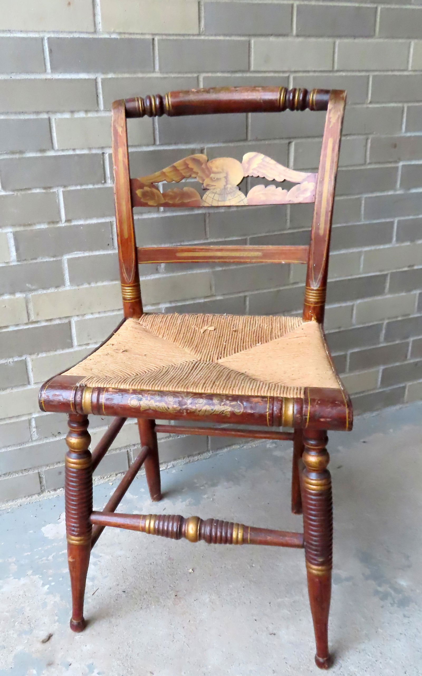 A Sheraton fancy chair with carved and painted eagle across back and having a replaced rope seat, (1 of 6)