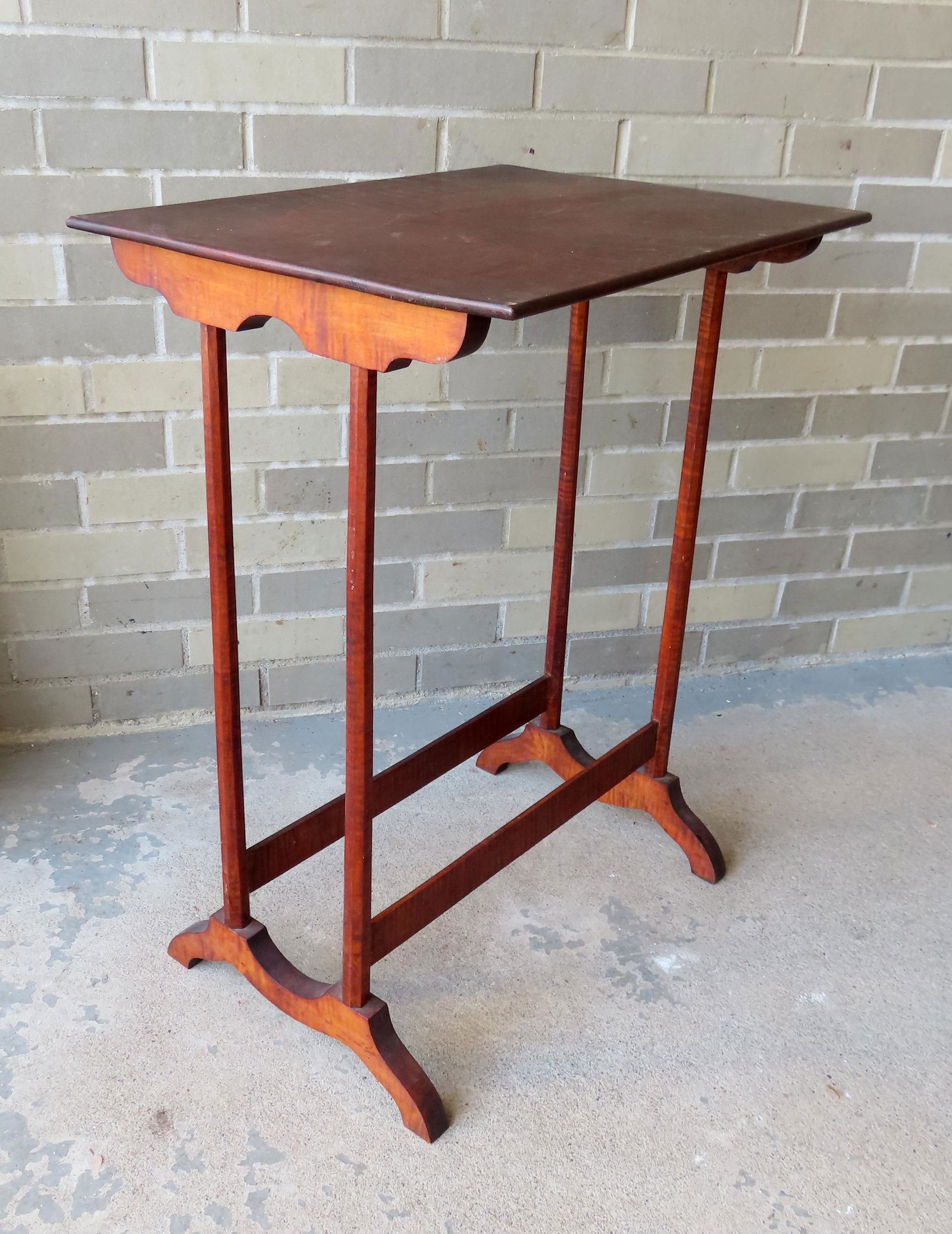 Tiger maple serving table with thin octagonal shaped tapered legs leading to supporting stretchers (1 of 12)