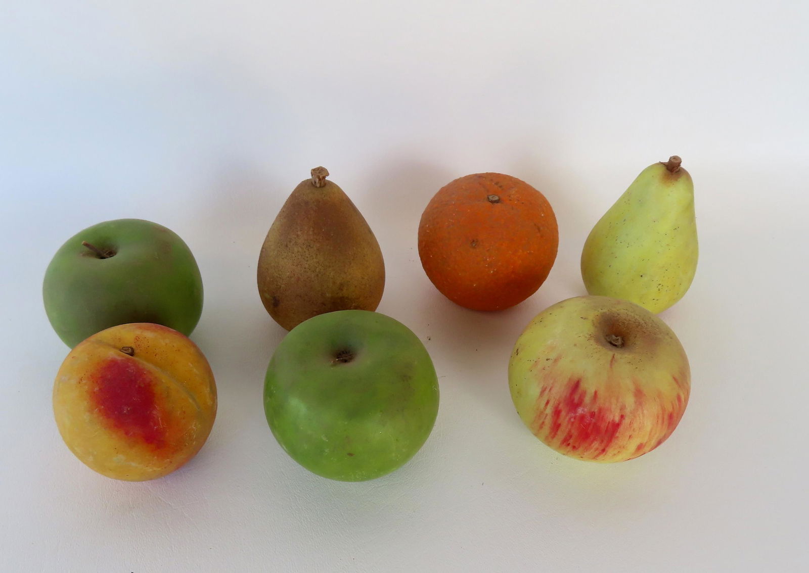 Seven piece of stone fruit including 3 apples, 2 pears, a peach and an orange, all life size and in (1 of 4)