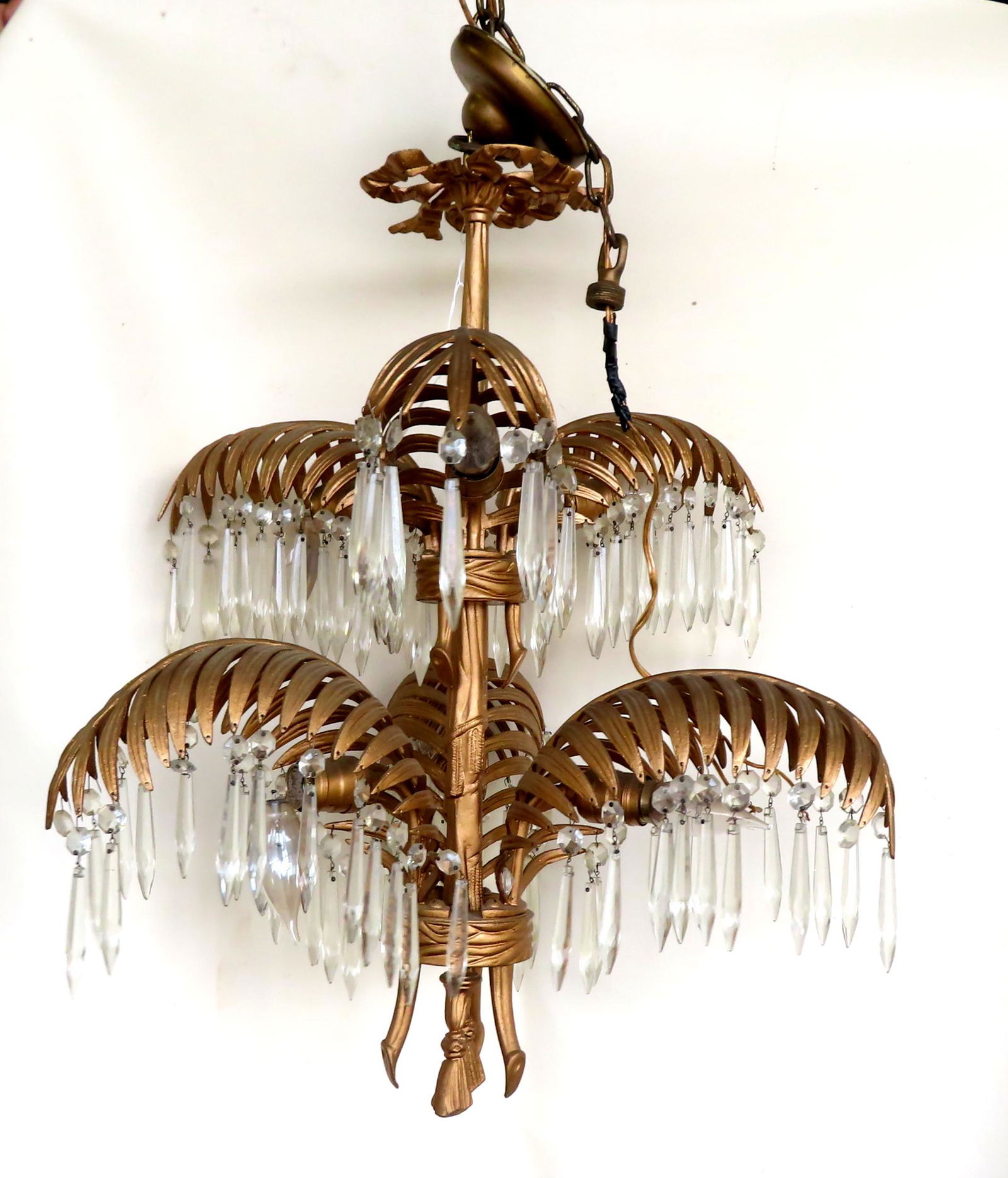 An unusual metal chandelier in newer gilt paint having fern shaped arms with attached glass prisms (1 of 13)