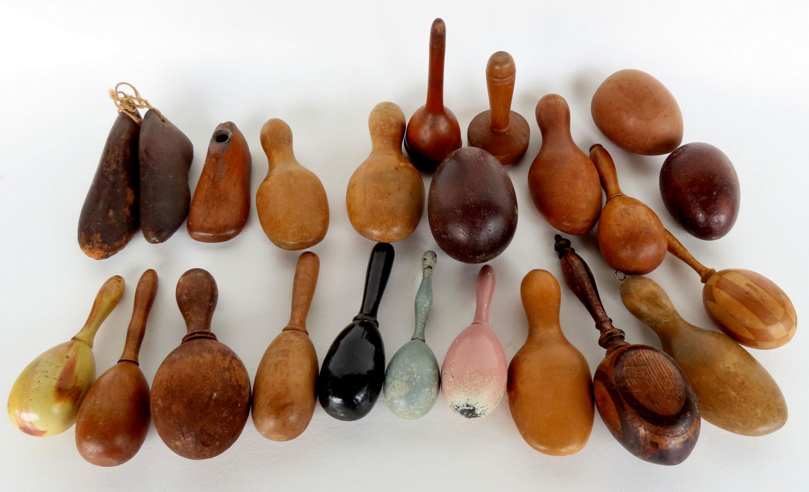 Grouping of 23 wooden sewing objects including many darning eggs including 2 with inlays and 2 in (1 of 4)
