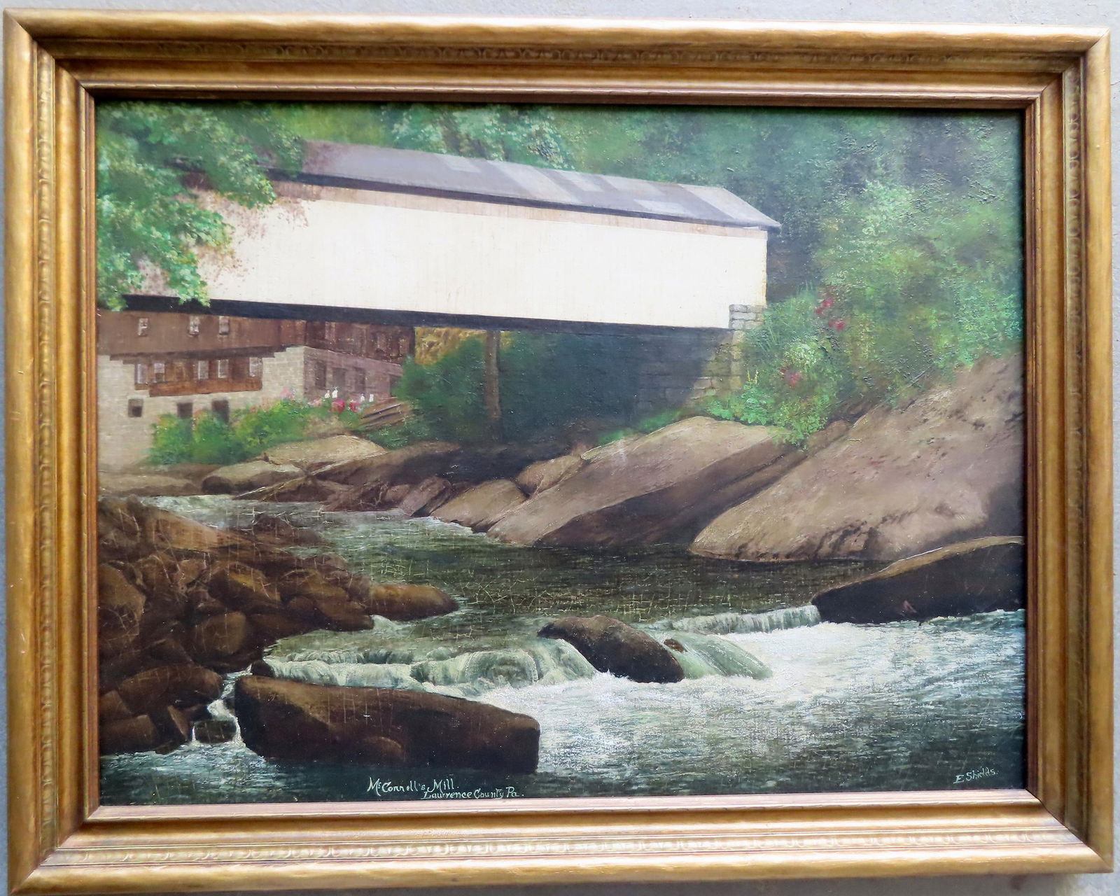 O/B Covered bridge over stream with mill in background, signed E. Shields, titled "McConnell's Mill (1 of 7)