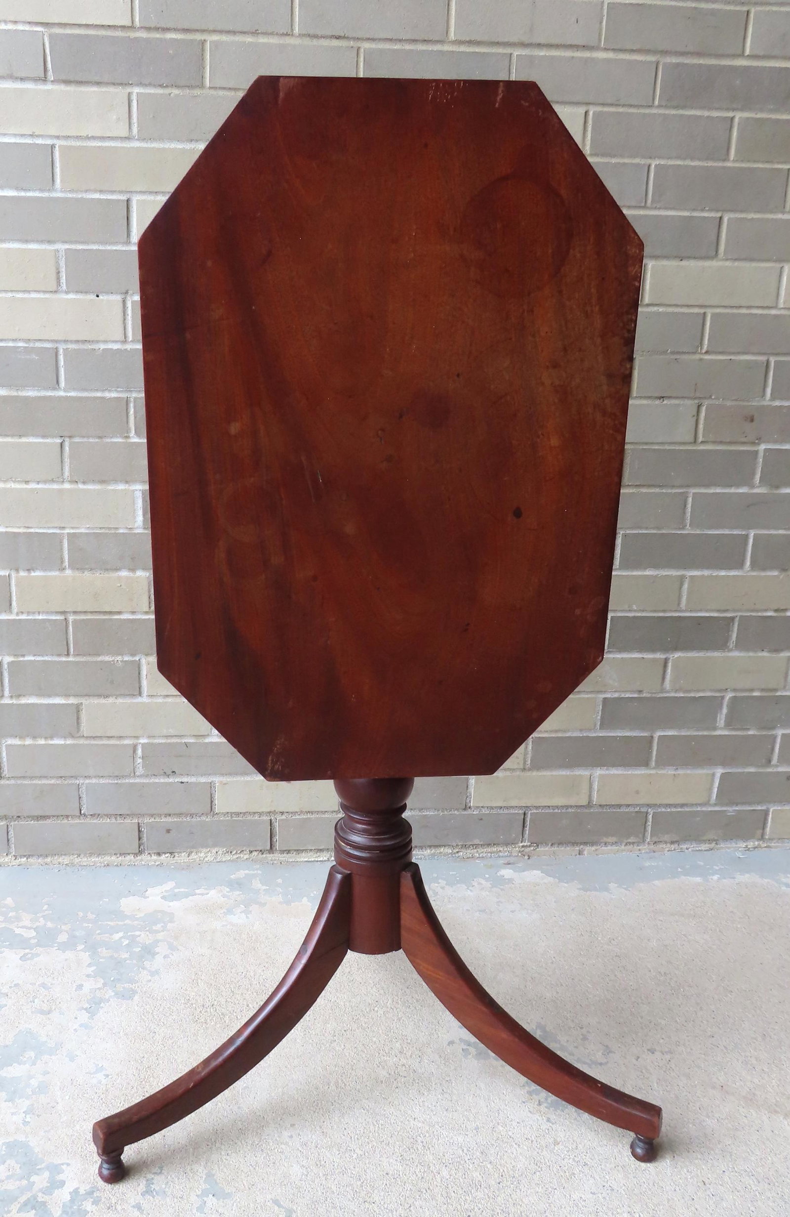 An early cherry tilt-top candlestand with octagonal shaped top over turned pedestal leading to (1 of 8)