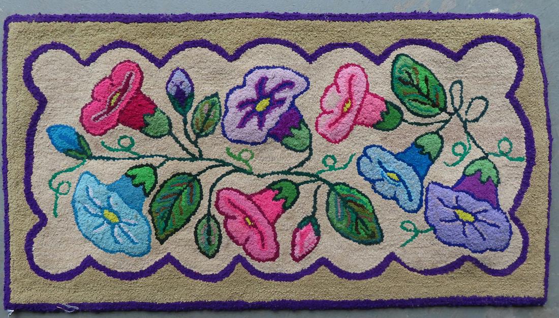 A good floral hooked rug that appear to be Morning Glories on vine, early to mid 20th century. (1 of 3)