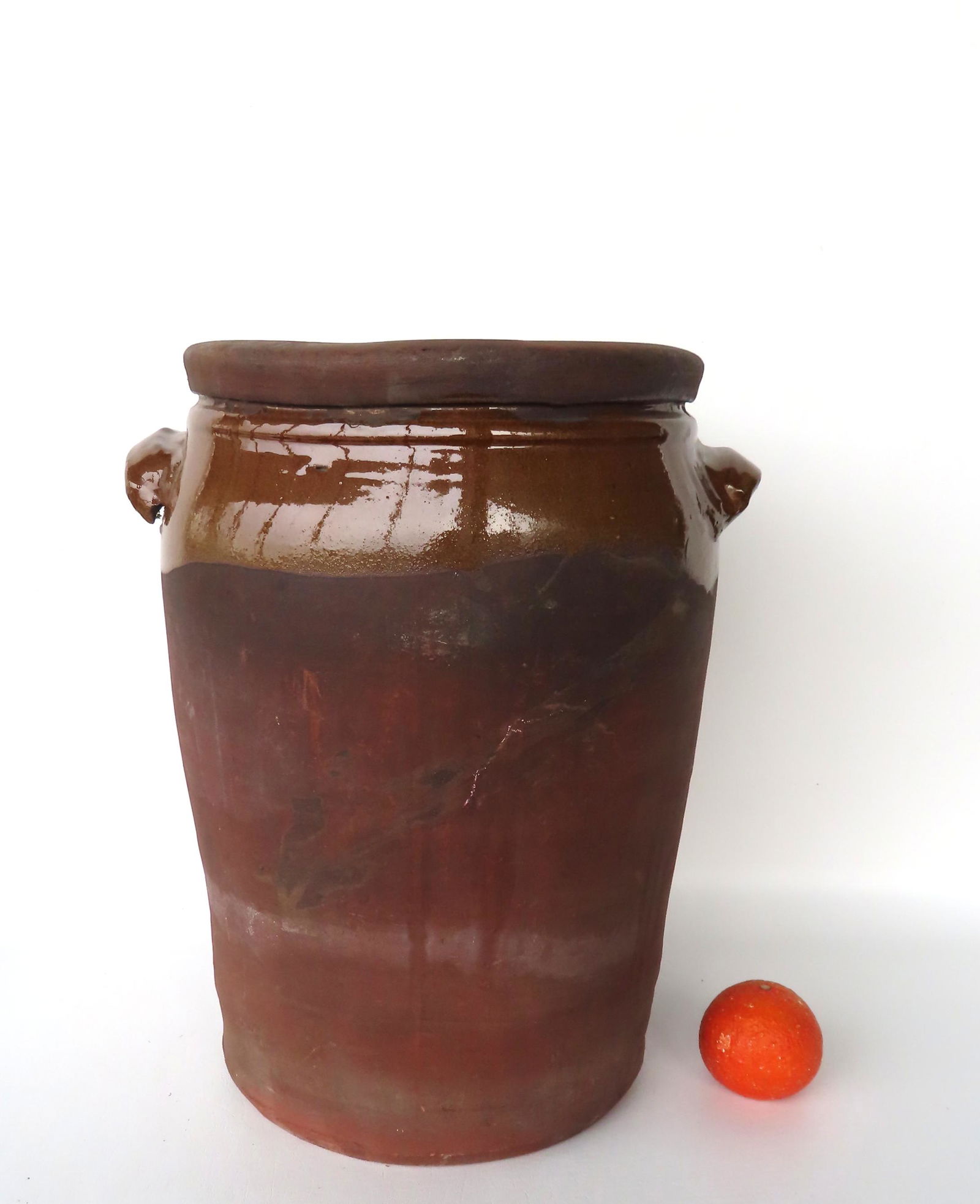 A large redware pot with applied handles and having an old make-do wooden lid - glazed only on (1 of 8)