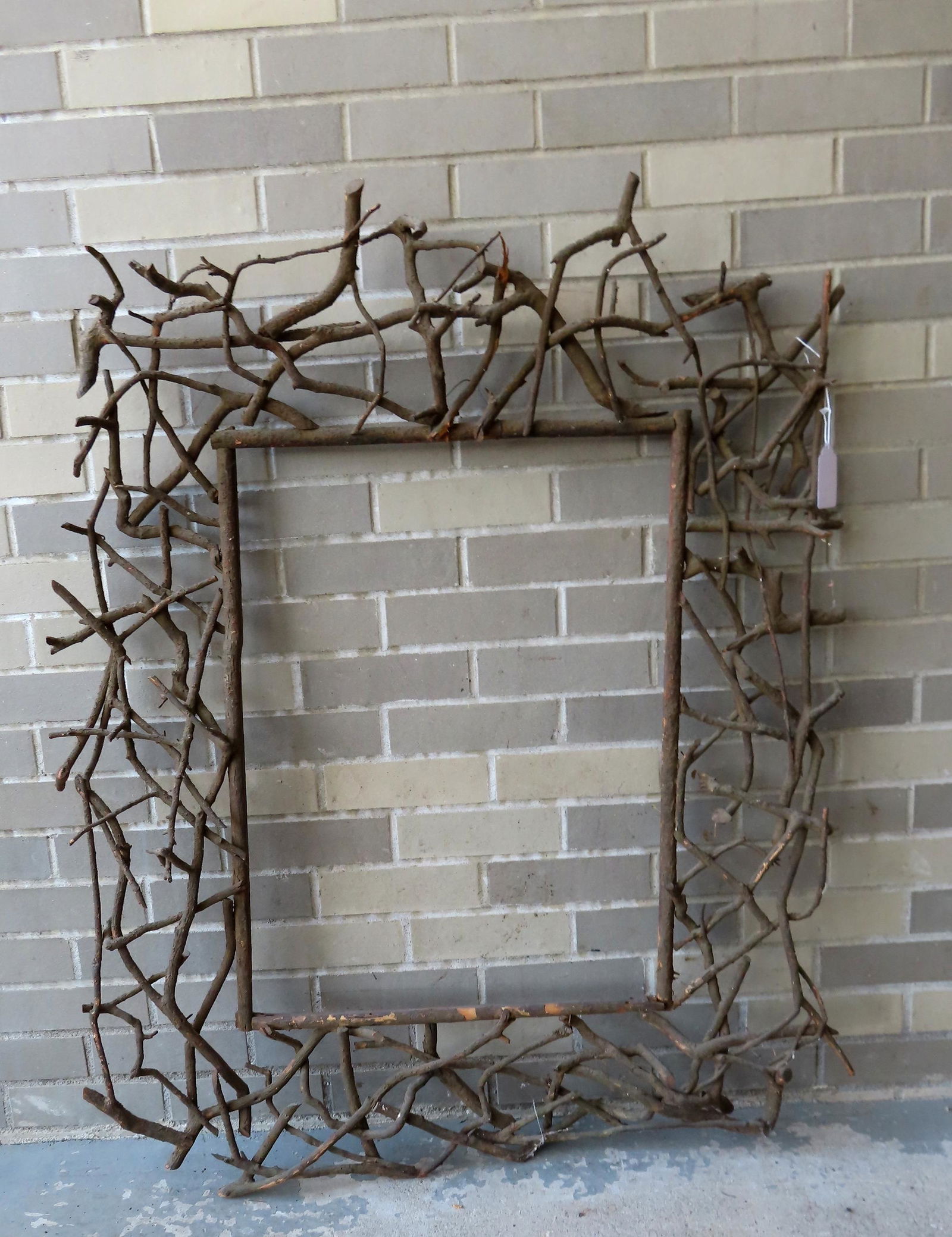 A rustic Adirondack twig frame, late 19th century. The twigs held together by mostly square nails. (1 of 4)