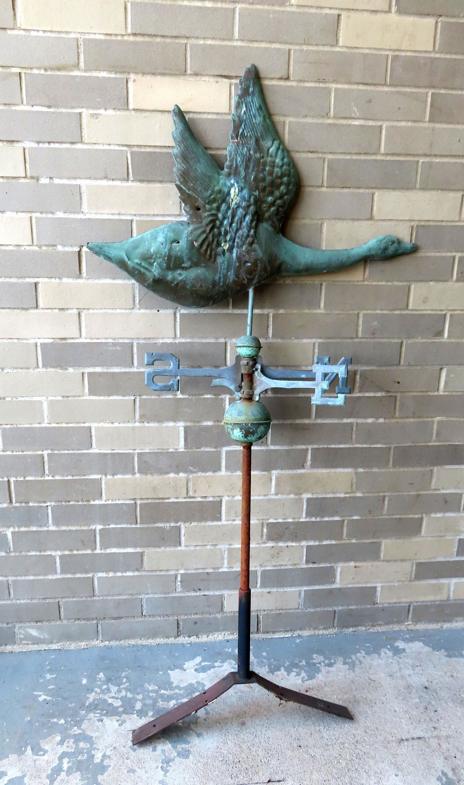 A flattened  body copper flying goose weathervane, circa 1970 with patinated surface - includes (1 of 9)