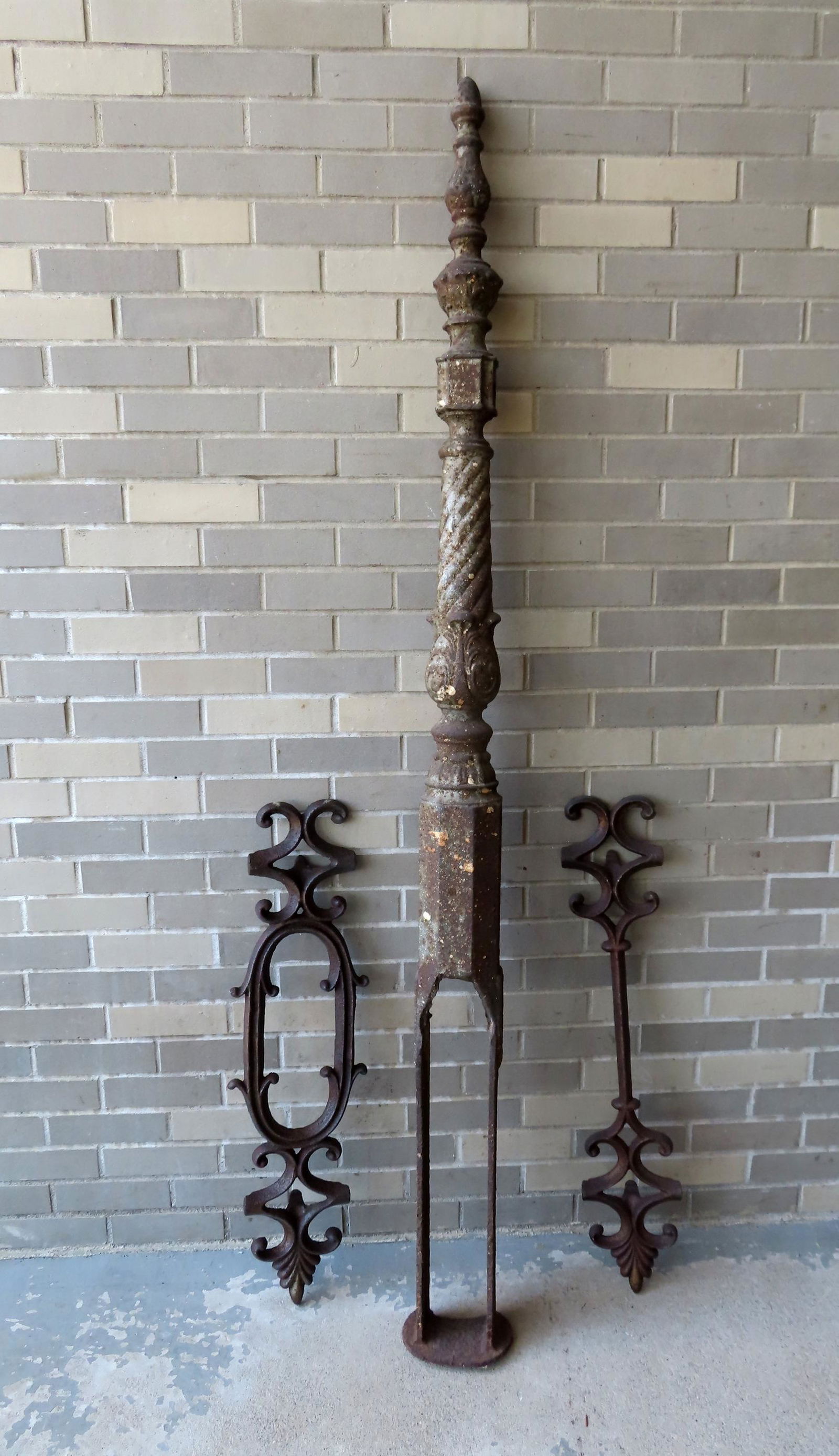 A large cast iron fence post plus 2 cast iron fence fragments. The fence post  with some surface (1 of 9)