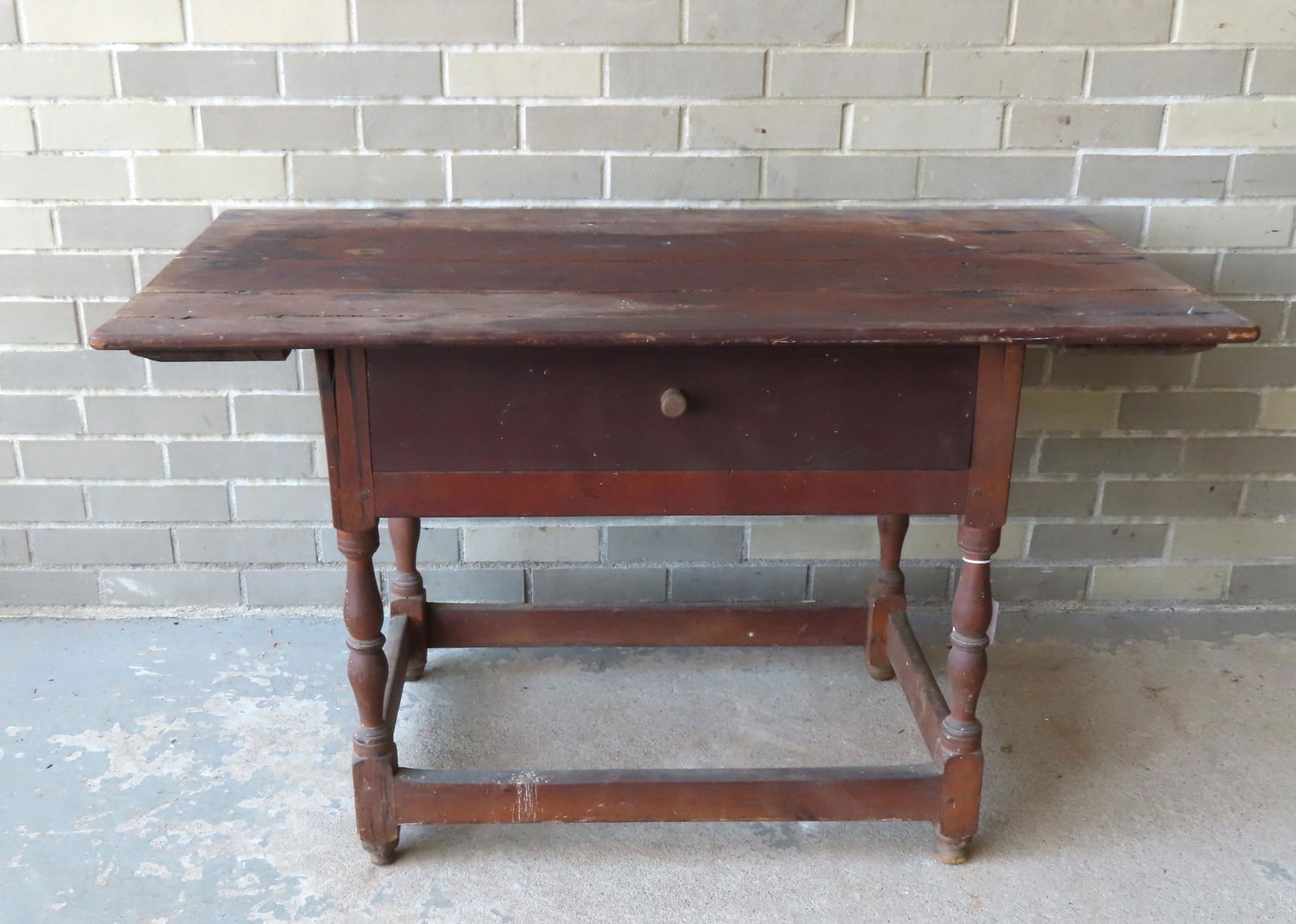 A primitive 18th century tavern table with false drawer, cross stretchers, worn button feet, top (1 of 13)