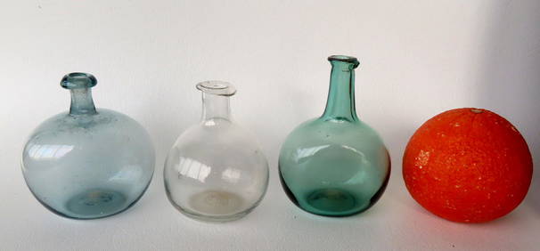 Three early miniature hand blown glass bottles including: 2 chestnut bottles with rolled lips - both (1 of 19)