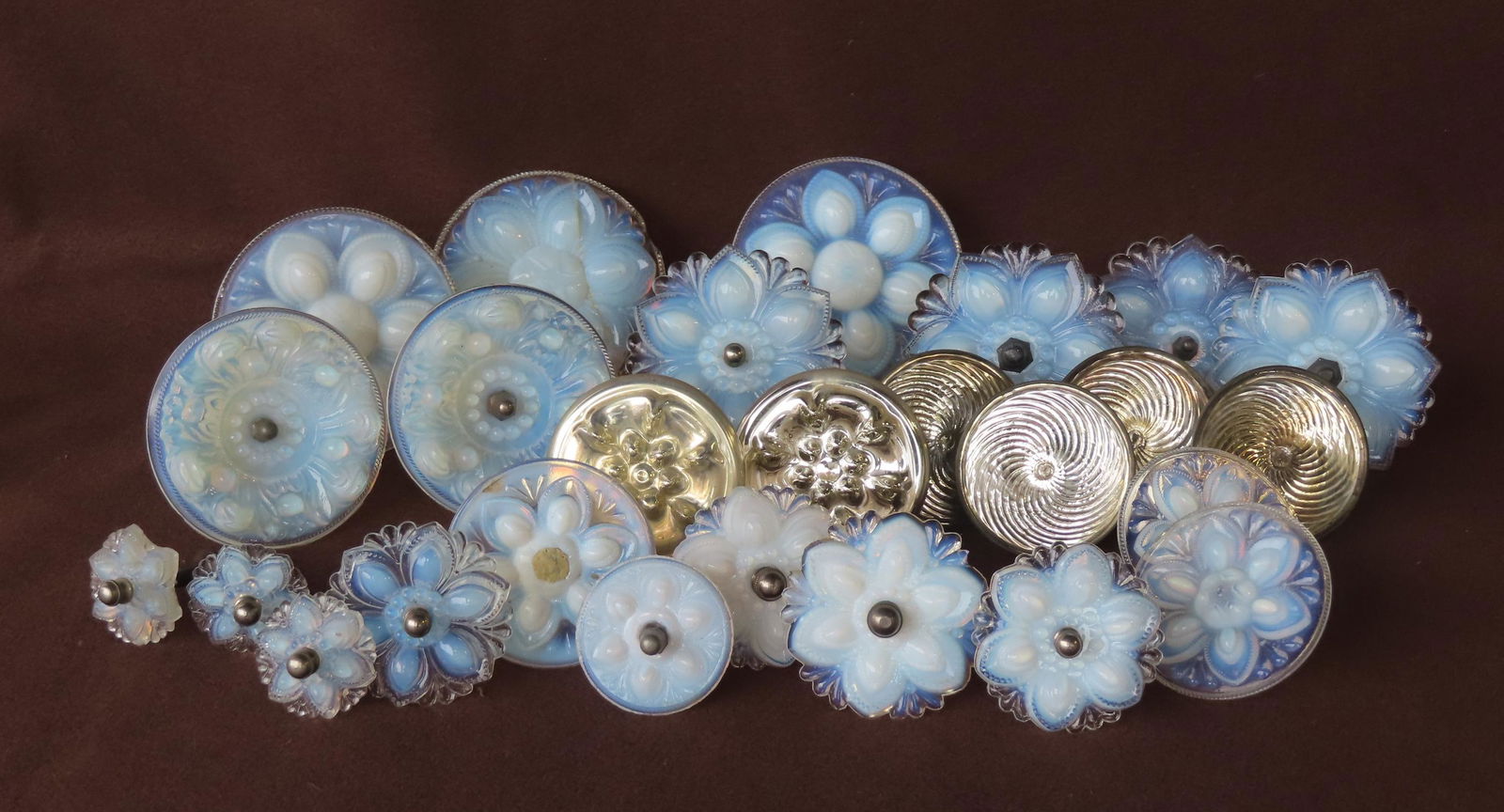 Grouping of twenty-six 19th century glass tiebacks including: 2 matching rosette form in mercury (1 of 10)