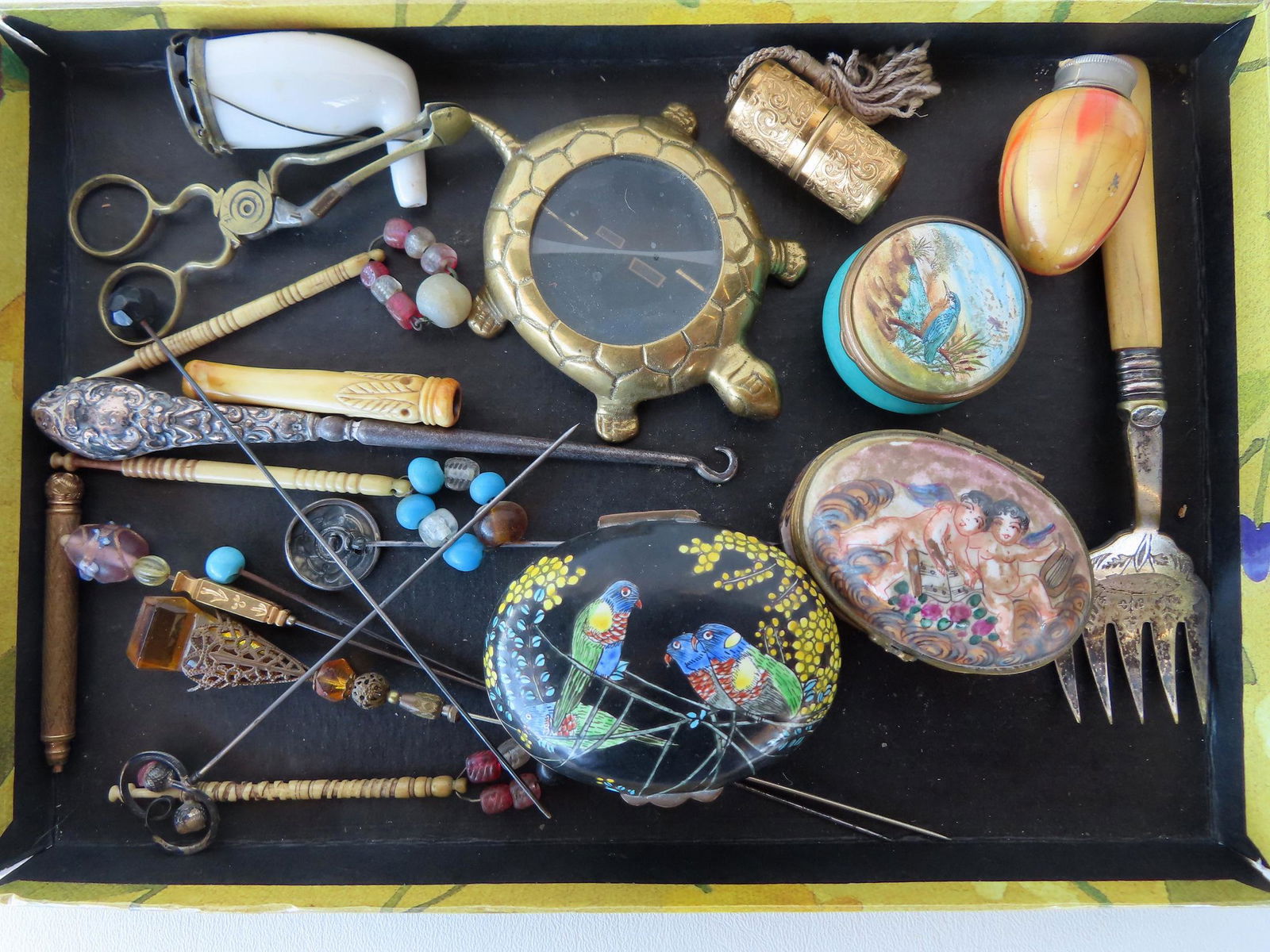 Grouping of decorative objects including: 3 porcelain patch boxes - one enameled decorated with: Grouping of decorative objects including: 3 porcelain patch boxes - one enameled decorated with parrots on black ground - very good condition, another decorated with hand painted cherubs marked in blu