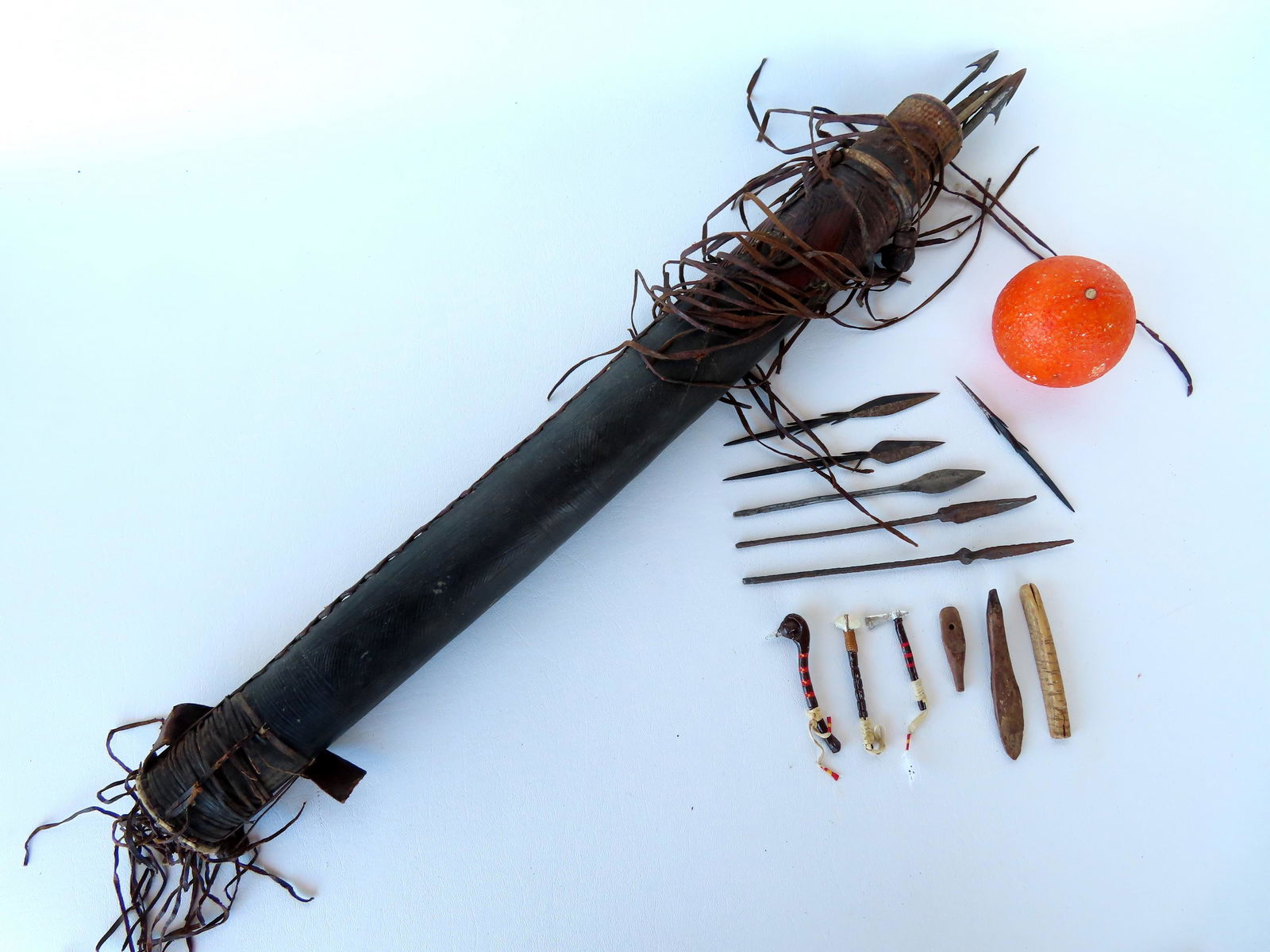 Grouping of ethnographic arrows and spear points. Includes a tooled leather quiver with 11 primitive (1 of 7)