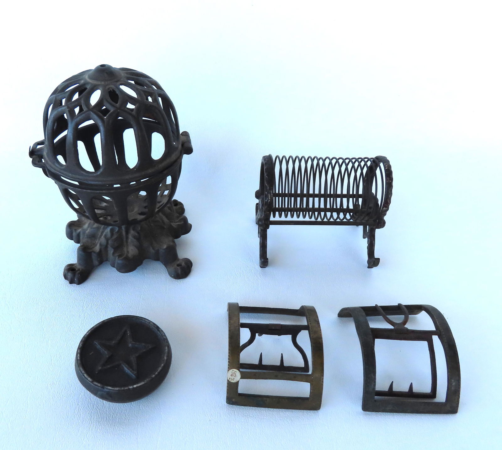 A grouping of country collectibles, all late 18th to late 19th century including: A cast iron string (1 of 6)