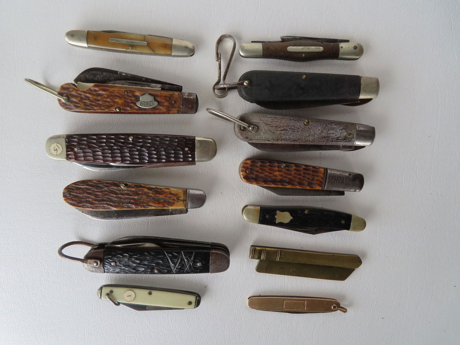 A grouping of 13 vintage pocket knives including: Remington UMC - Scout, Hoffritz Cutlery, American (1 of 4)