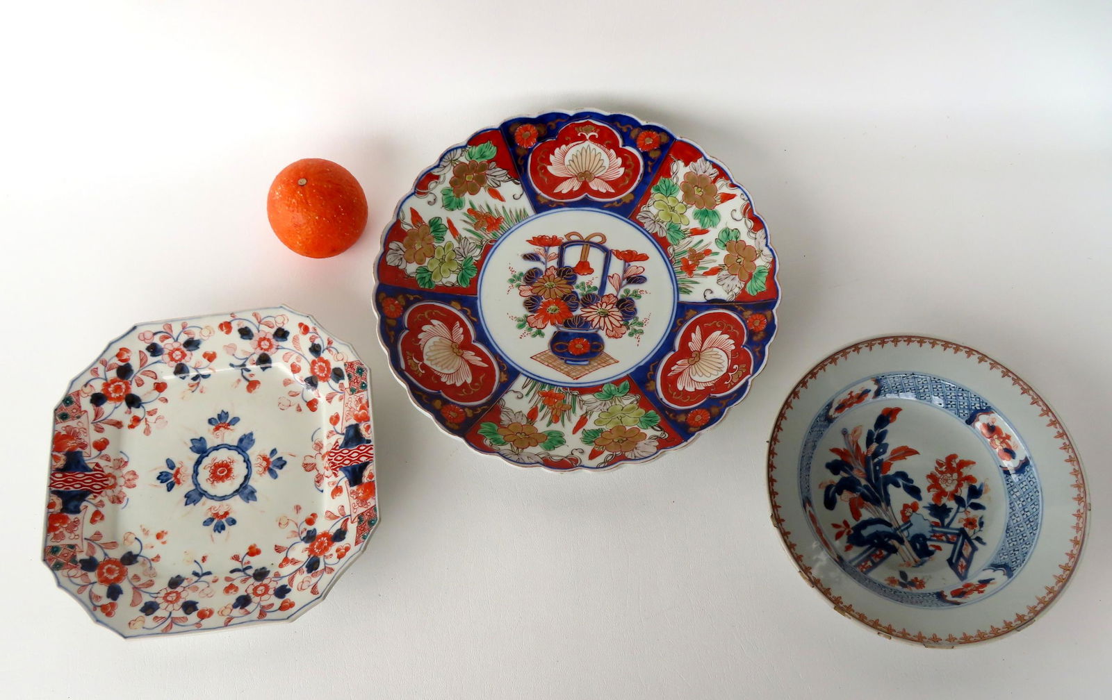 Three oriental plates/charger in predominately red and blue floral palette, including: An Imari (1 of 8)
