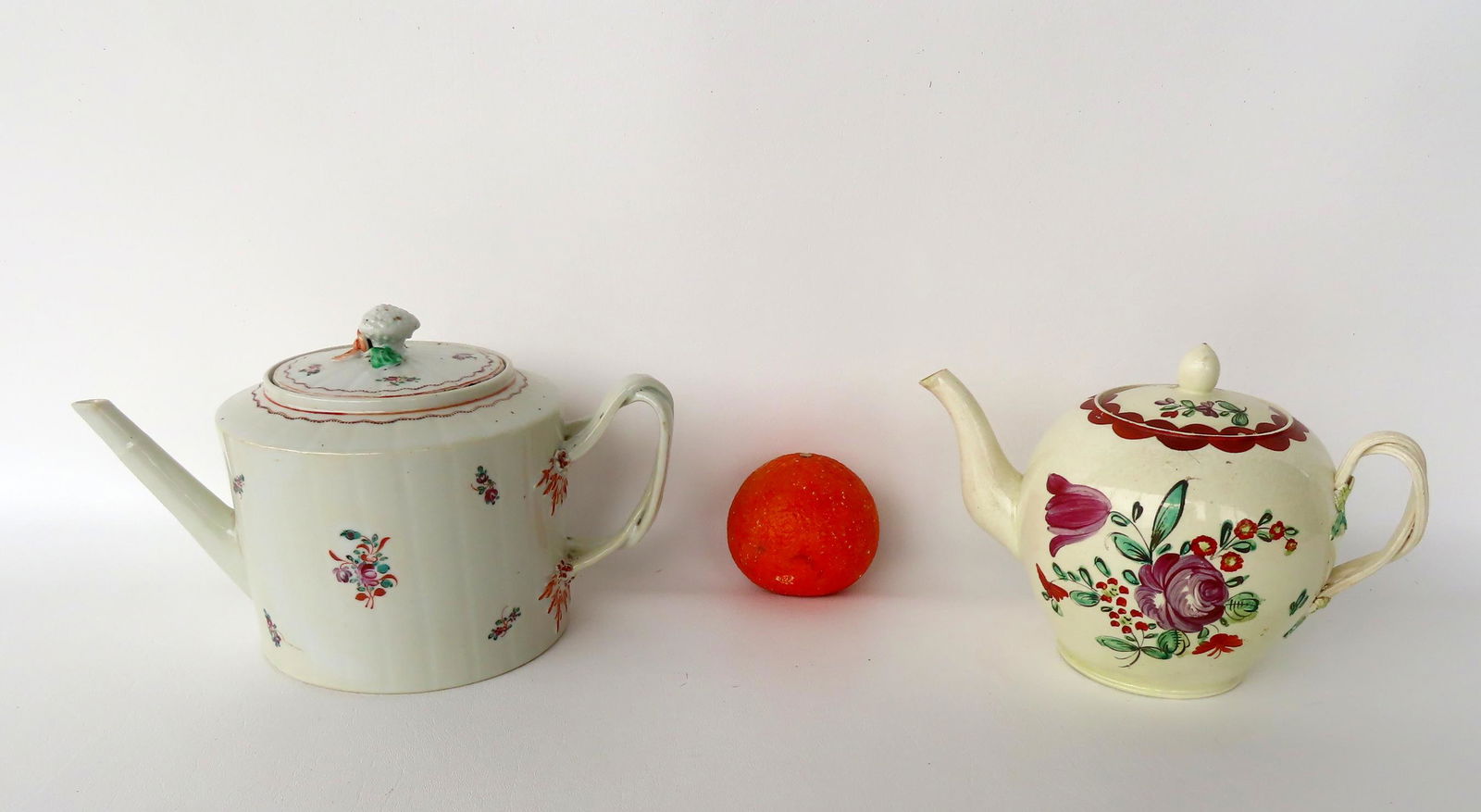 Two very fine 18th century porcelain teapots. 1) English creamware teapot with hand painted flowers (1 of 14)