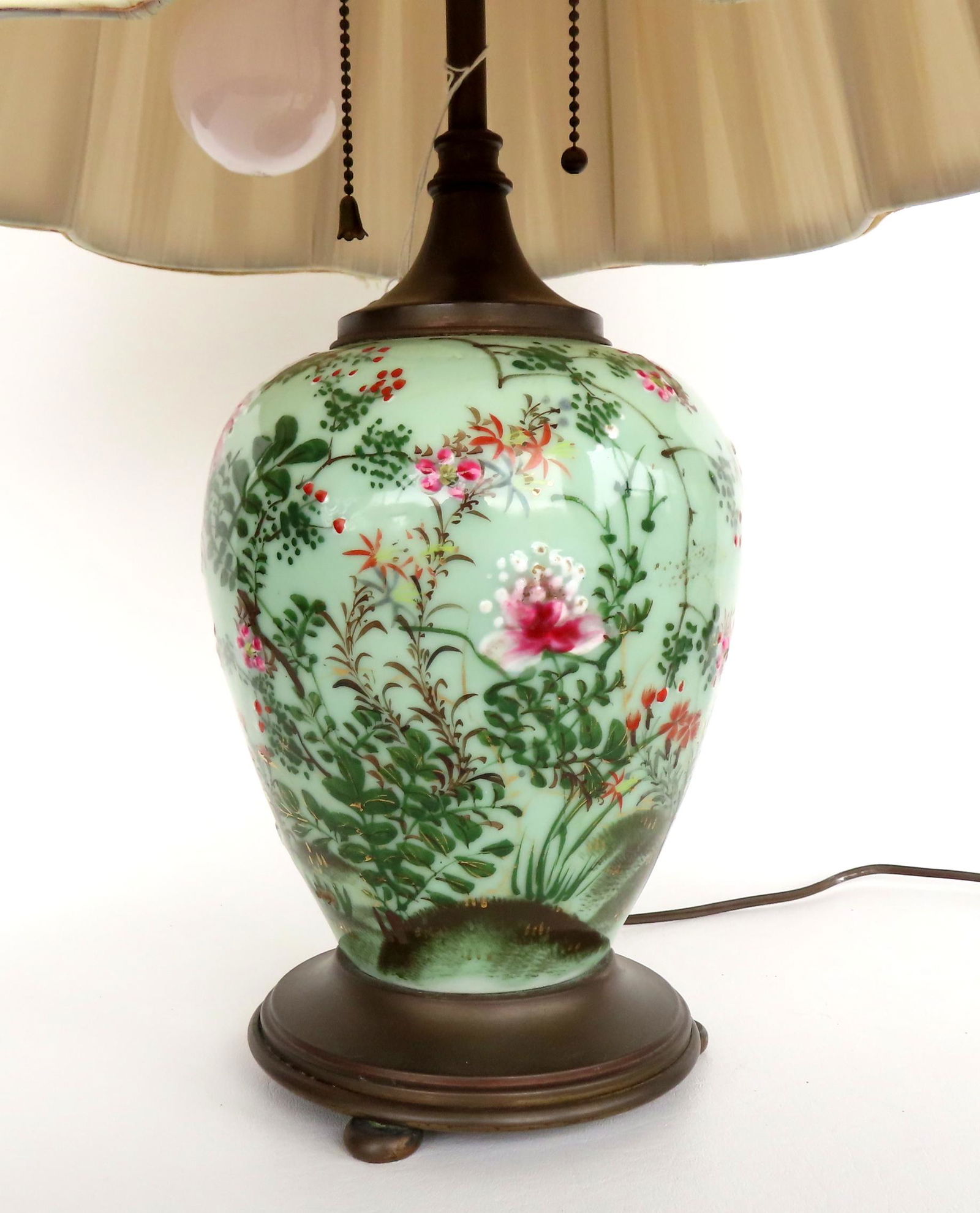 A fine hand painted oriental celadon lamp decorated with flowering plants and grassy knolls in (1 of 9)