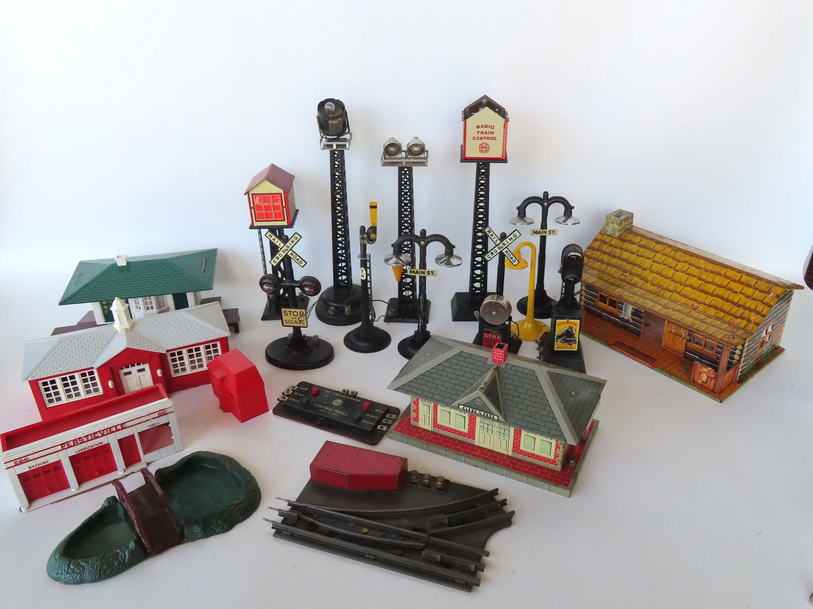 Grouping of Marx train accessories in tin including: Girard lithograph tin station - one section of (1 of 7)