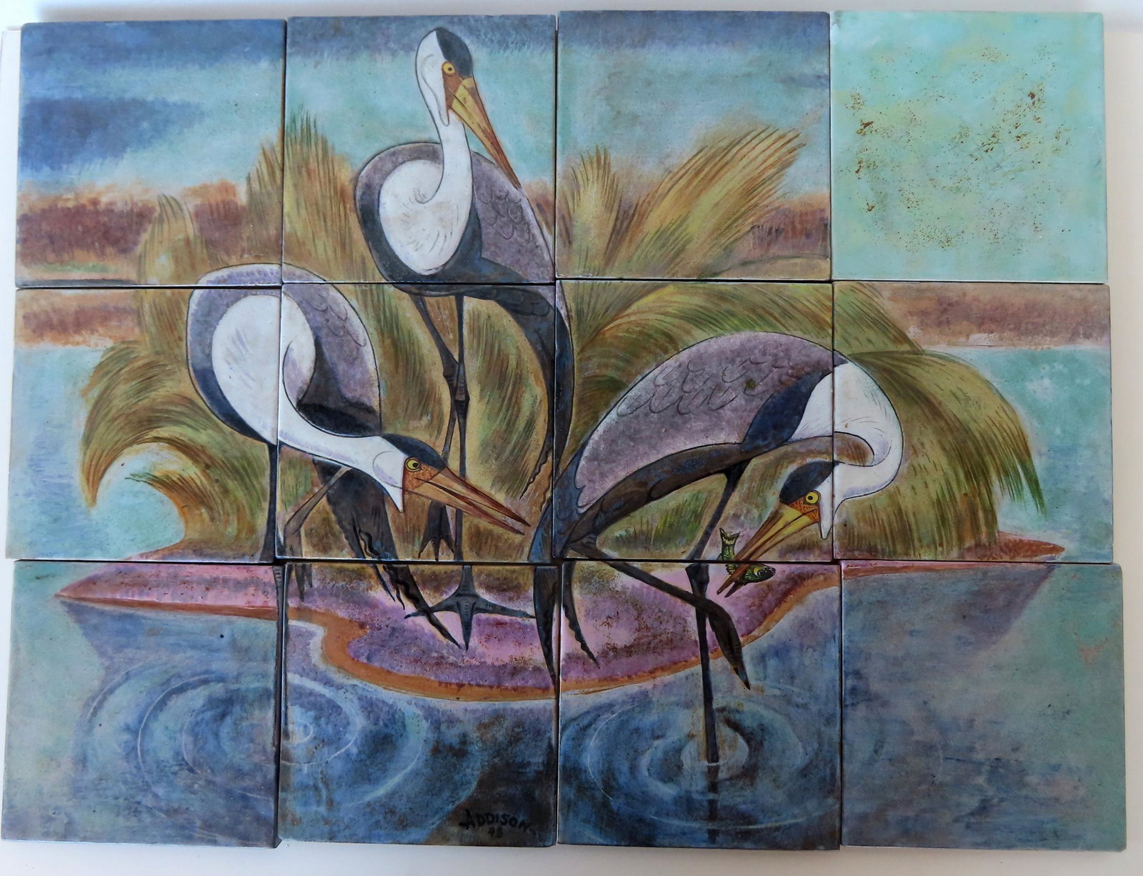 Walter Addison, New York, 1914-1982. A 12 piece terra cotta tile mural that forms an image of 3: Walter Addison, New York, 1914-1982. A 12 piece terra cotta tile mural that forms an image of 3 Blue Heron fishing in shallow water and signed "Addison 48", likely 1948 - the tile in the upper right c