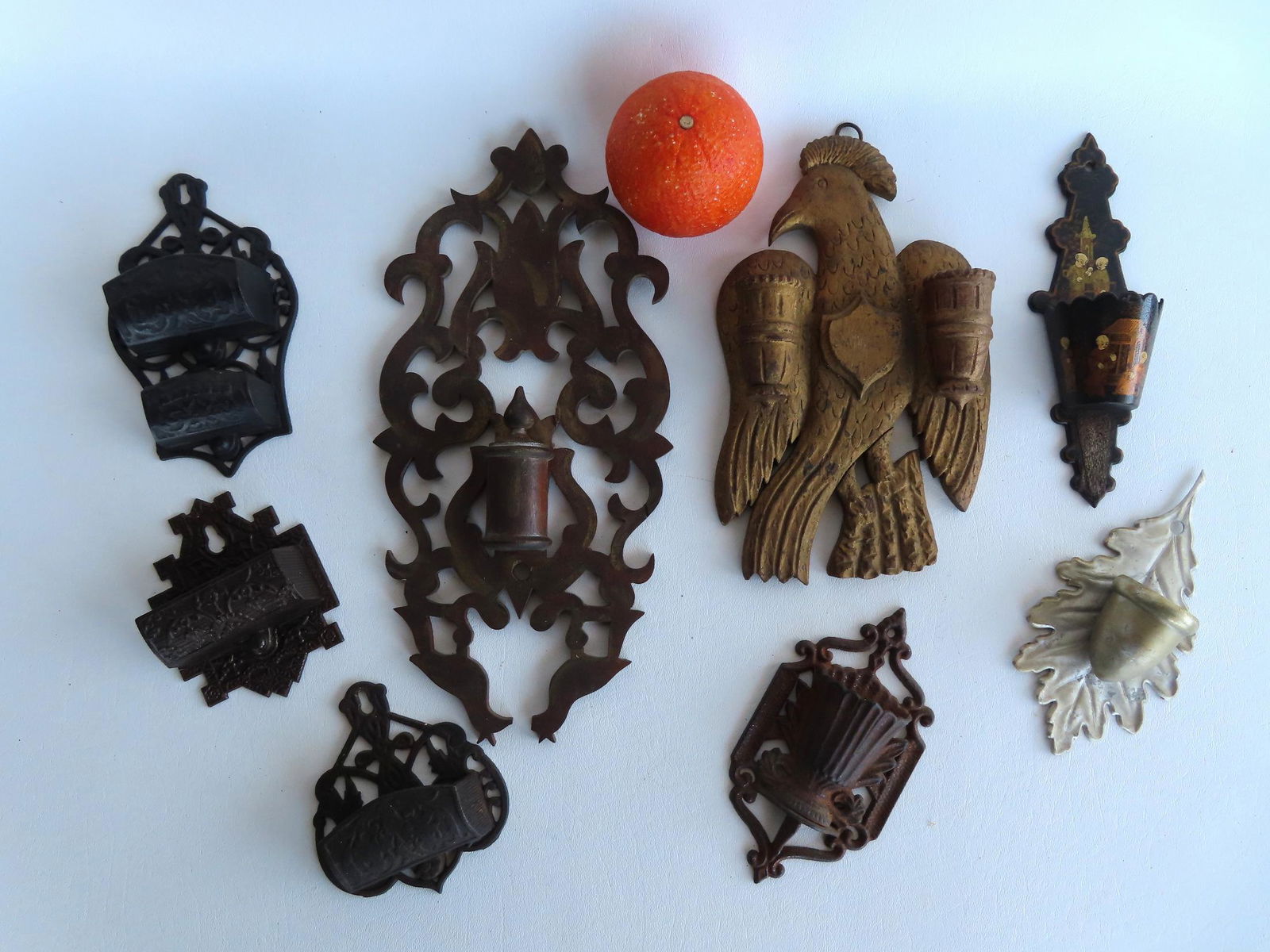 A grouping of 8 match safes, 4 in cast iron - 19th century, 1 in silvered tin - leaf form, a hand (1 of 7)