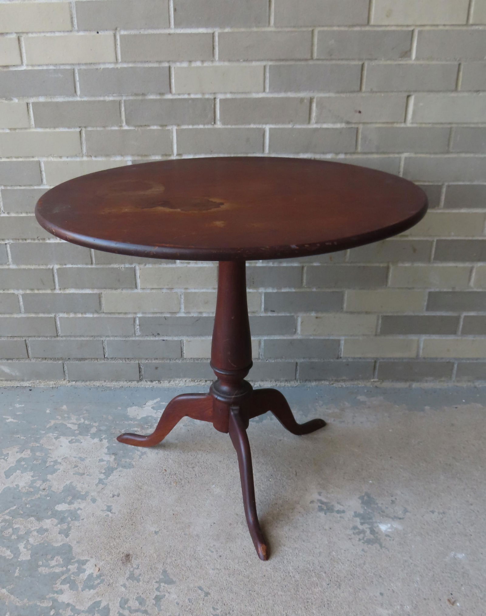 A walnut Queen Ann candlestand with oval top and snake feet, late 18th century. The top reinforced (1 of 5)
