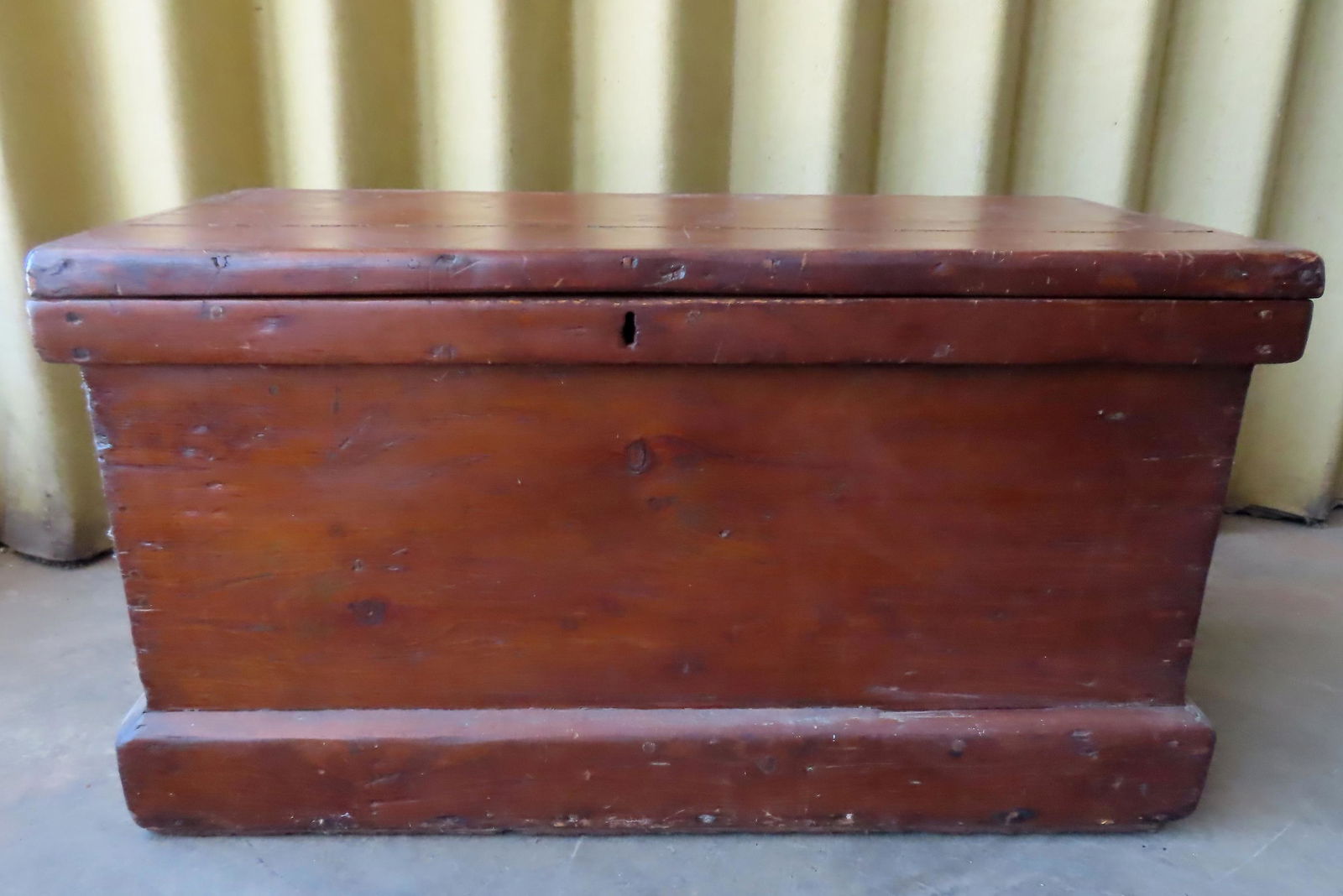 A large pine refinished tool box with iron handles and mounted on casters, late 19th century. Use (1 of 5)