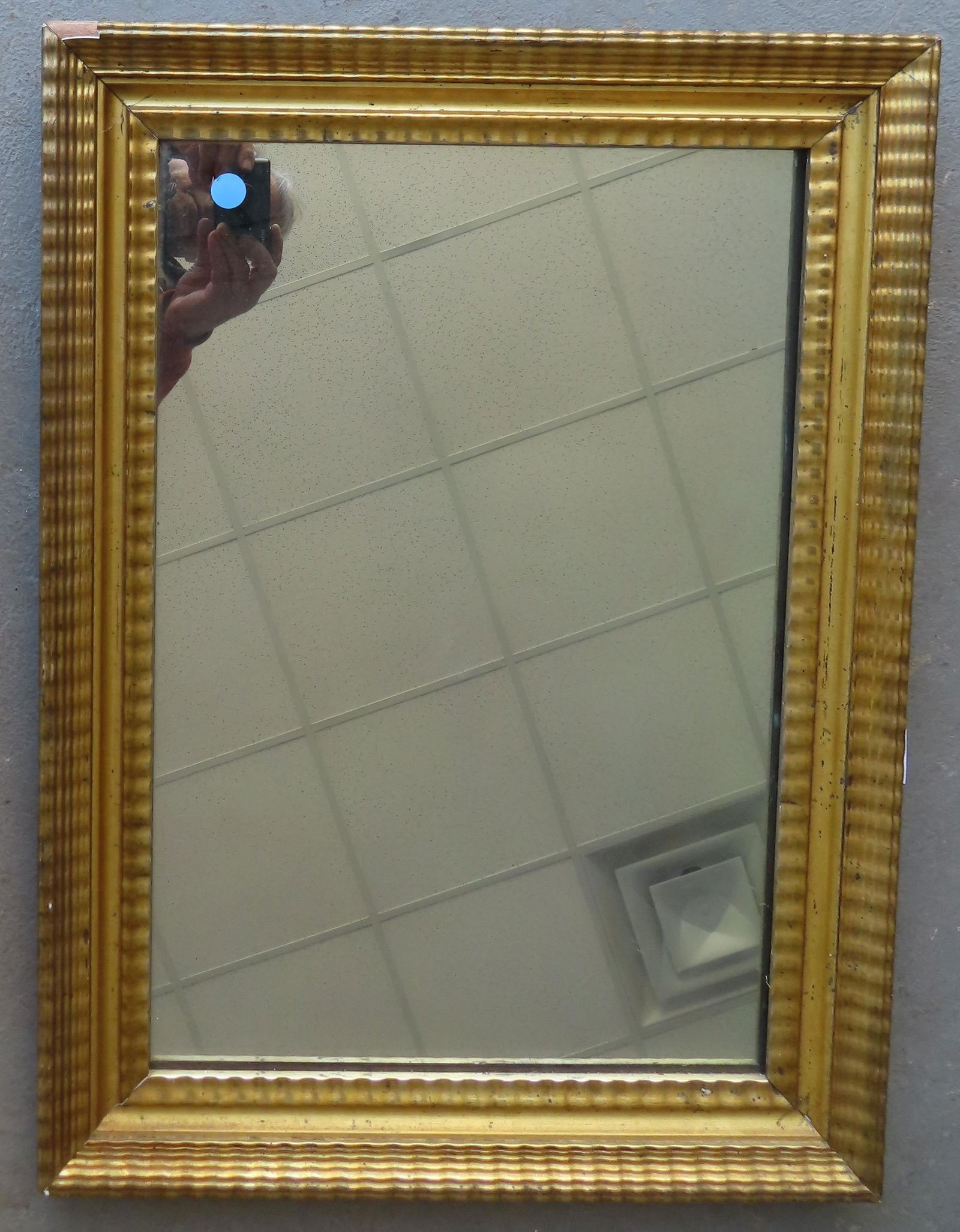 An early lemon gold frame currently housing a newer mirror. The frame, early to mid 19th century, (1 of 5)