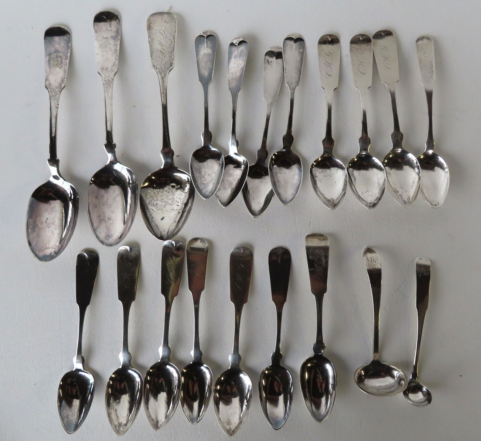 Grouping Of 18 Pieces Of Coin Silver, 18 Spoons And 2 Small Ladles. All