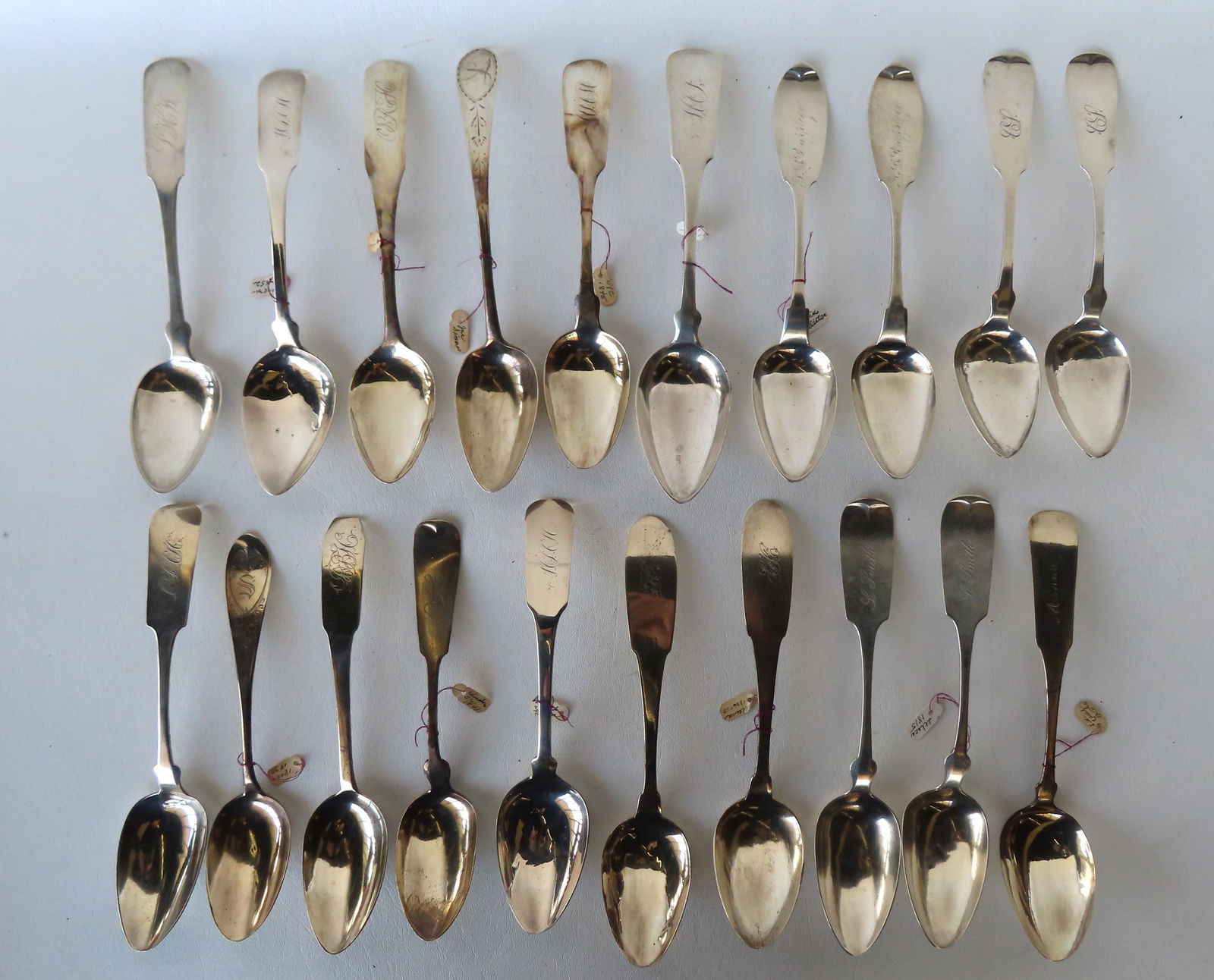 Grouping of 19 coin silver large serving spoons ranging in size from 7"L to 9"L, total of 26 troy (1 of 14)