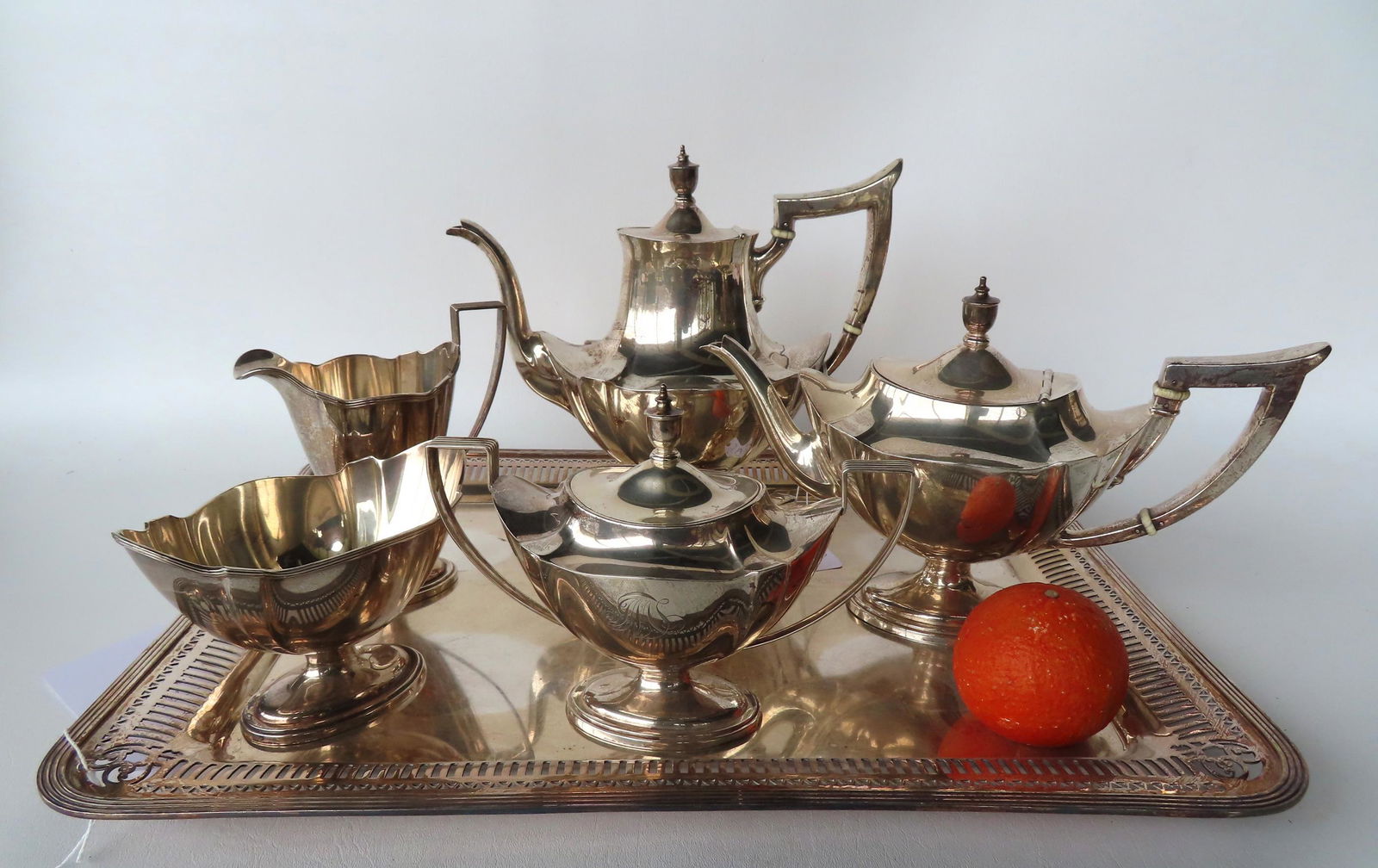 A sterling silver 5 piece tea service and a silver plated tray. The sterling hallmarks appear to be (1 of 7)