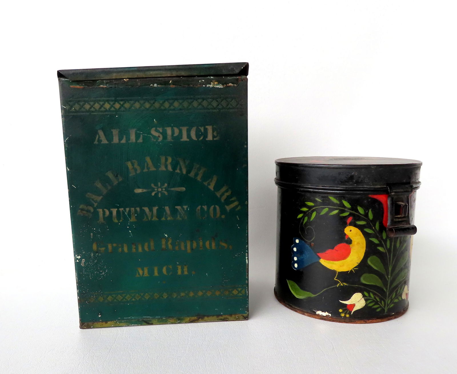 Two pieces of toleware. The first, a spice box in original paint stenciled "All Spice / Ball (1 of 6)