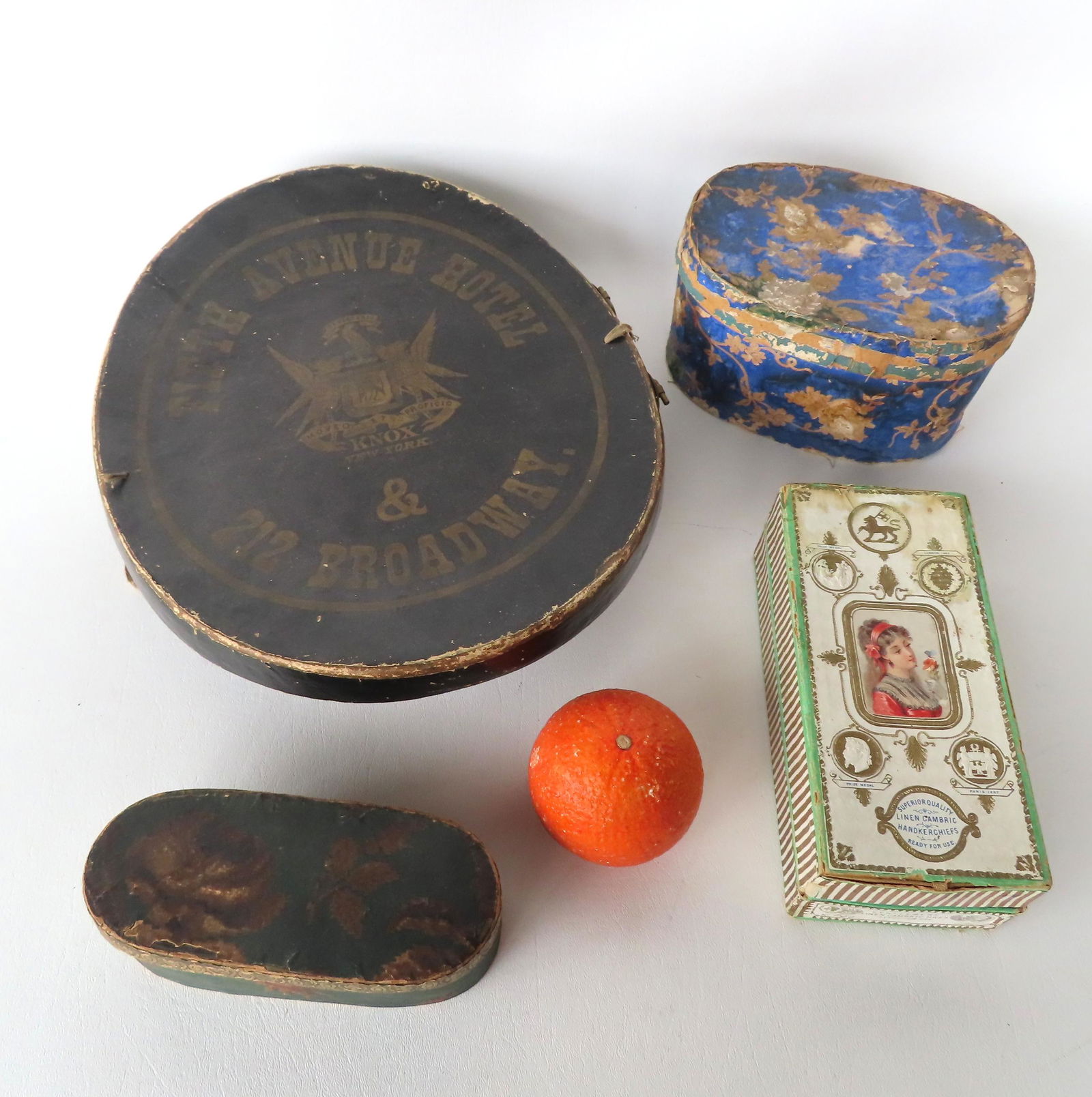 Grouping of lady's articles including: Small oval wall-papered box containing a doll's hand; a (1 of 11)