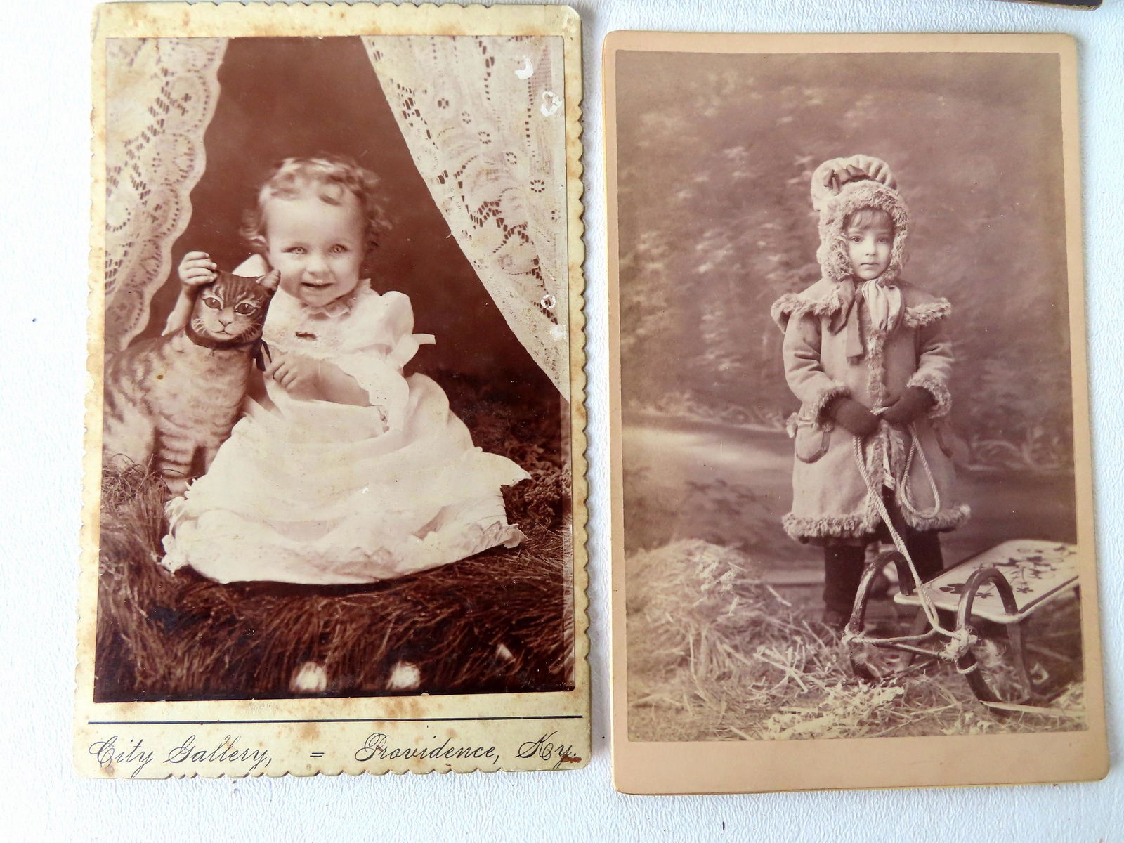 Grouping of 23 photos of children with toys and dolls including cabinet cards, tintypes, and CDV's, (1 of 8)