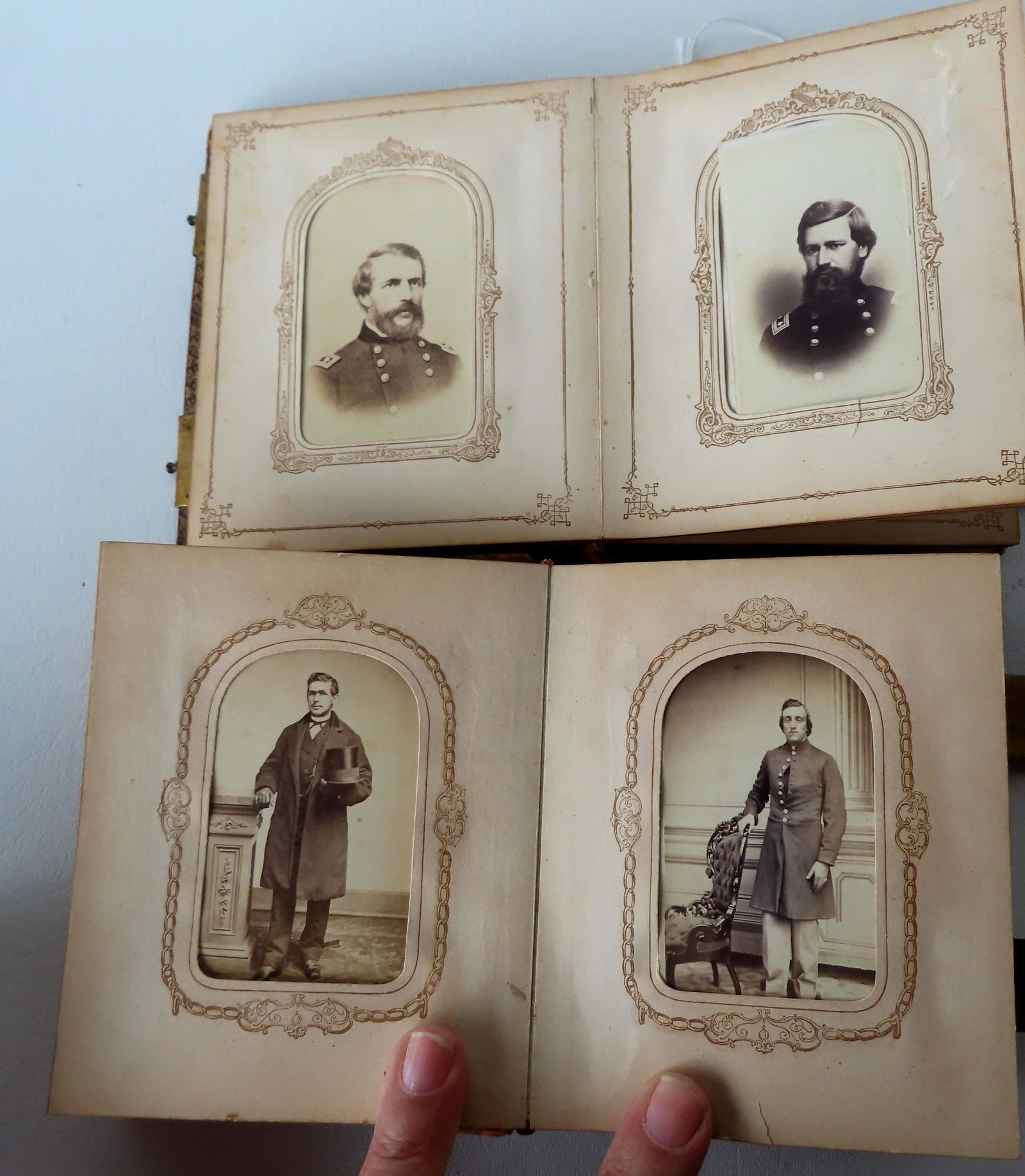 Two CDV photo albums. The first with 8 soldier CDV's, most appear to be lithographs, plus a photo of (1 of 13)