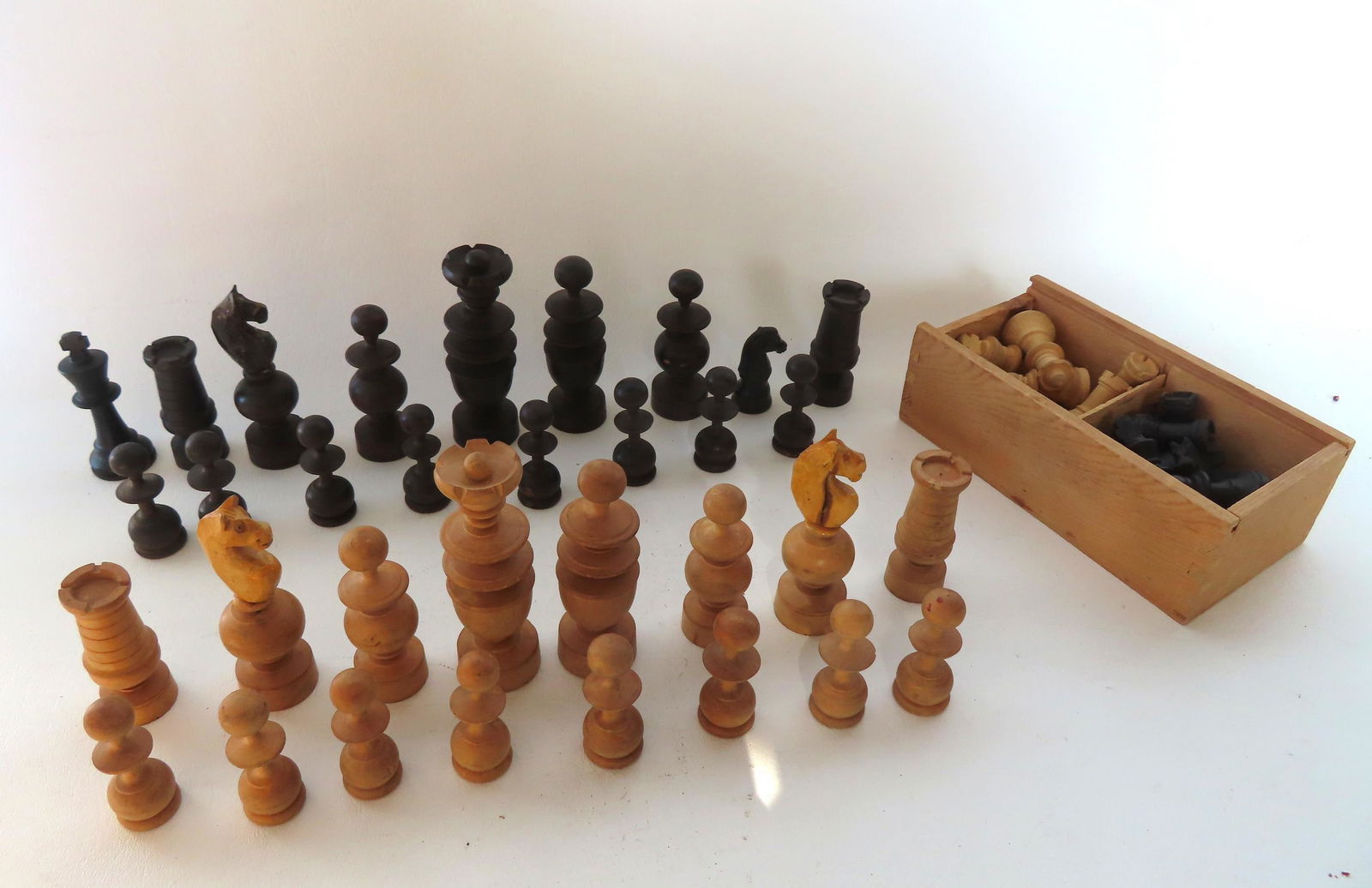 Two carved wooden chess sets in original slide-lid boxes, the smaller box is dovetailed and is missi (1 of 5)