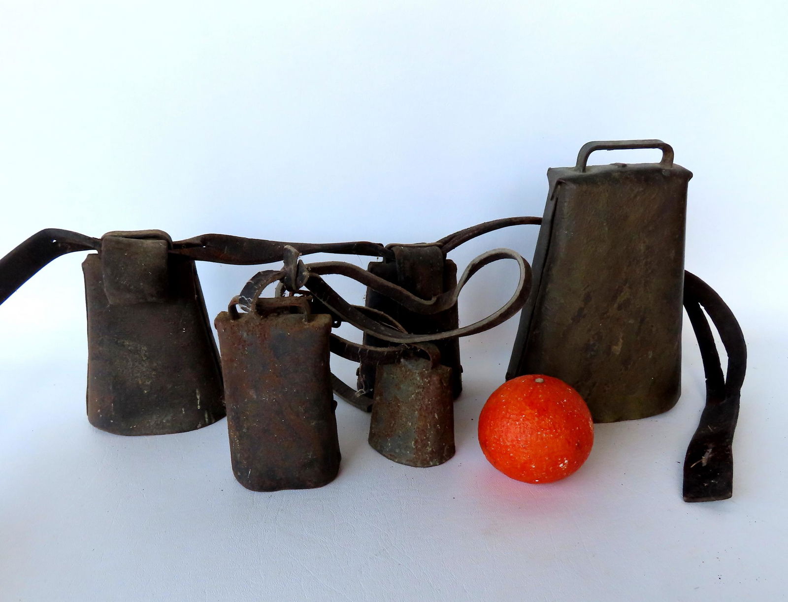 Grouping of 5 primitive metal handmade cow bells, 19th century. (1 of 2)