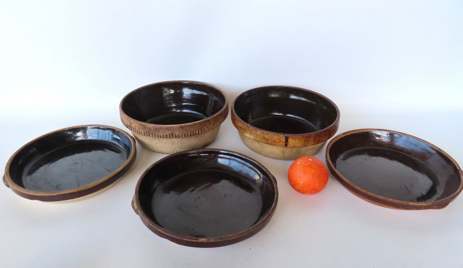 Grouping of 5 stoneware cooking bowls and cake plates, late 19th century. (1 of 7)