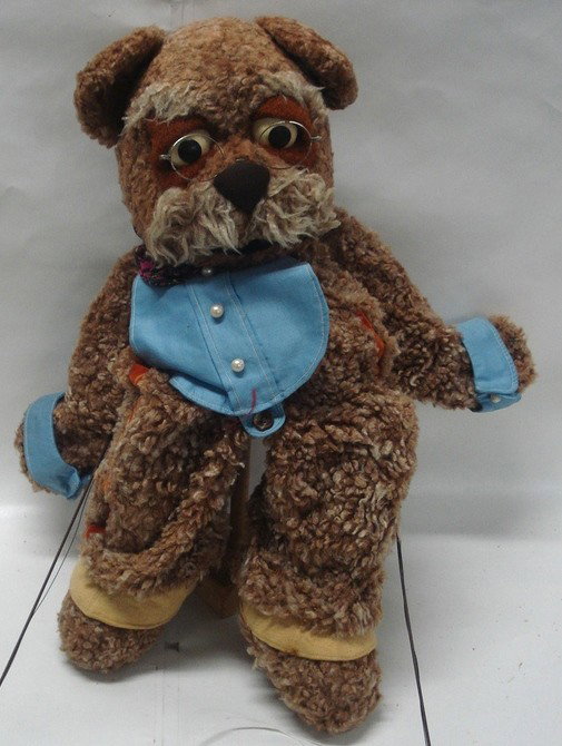 Mechanical bear hand puppet - mechanics move the: Mechanical bear hand puppet - mechanics move the bears forearms. Costume includes vest, cufflinks and spats.