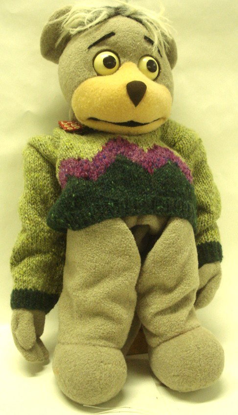 Bear hand puppet dressed in sweater and bow-tie.: Bear hand puppet dressed in sweater and bow-tie.