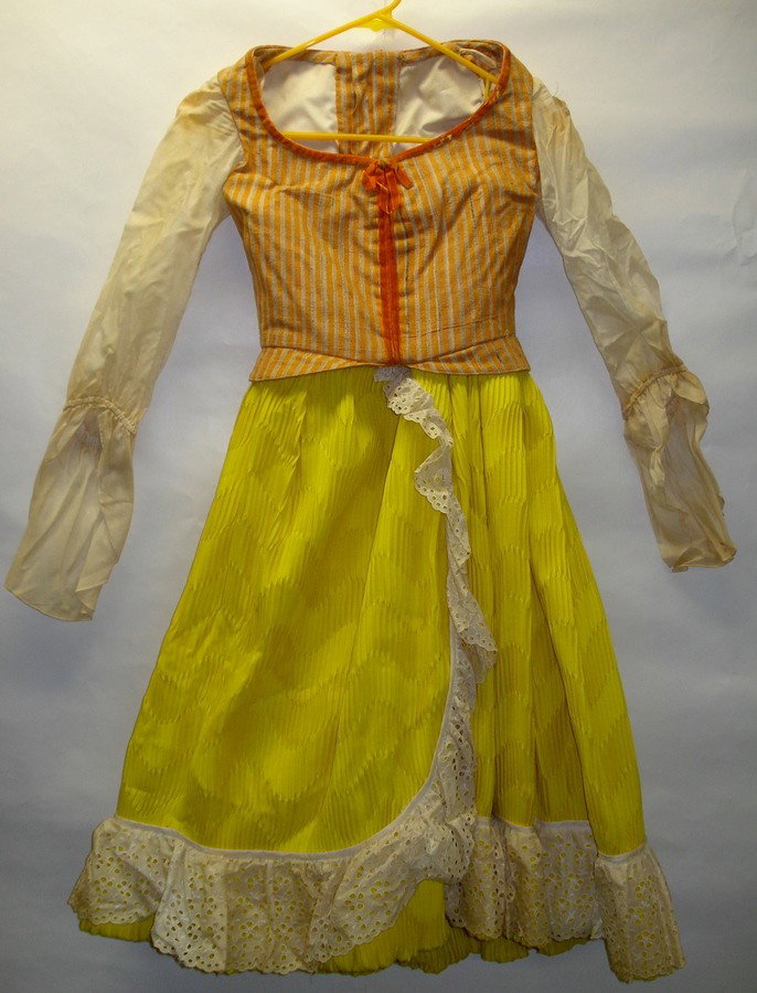 Rare theatrical costume signed Karinska.: Child size theatrical costume consisting of vest and matching yellow skirt with attached undergarment. Label attached signed Karinska (Barbara Karinska,Oscar winning costume designer, 1886-1983, born 